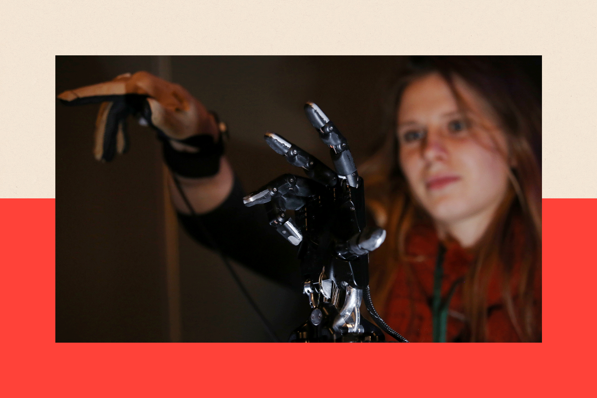 A woman demonstrates a robotic hand
