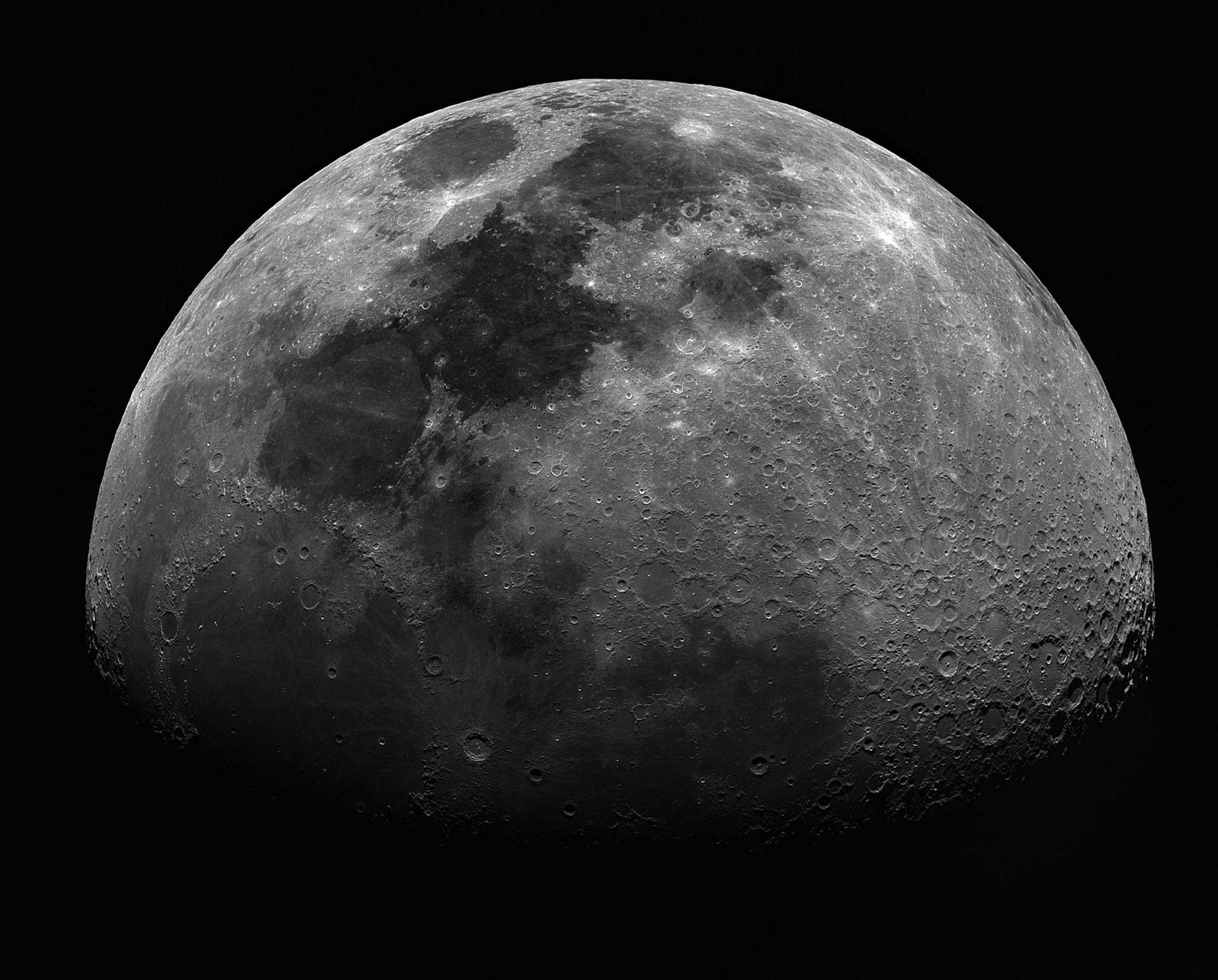 An image of the Moon with three quarters illuminated. Against a dark background.