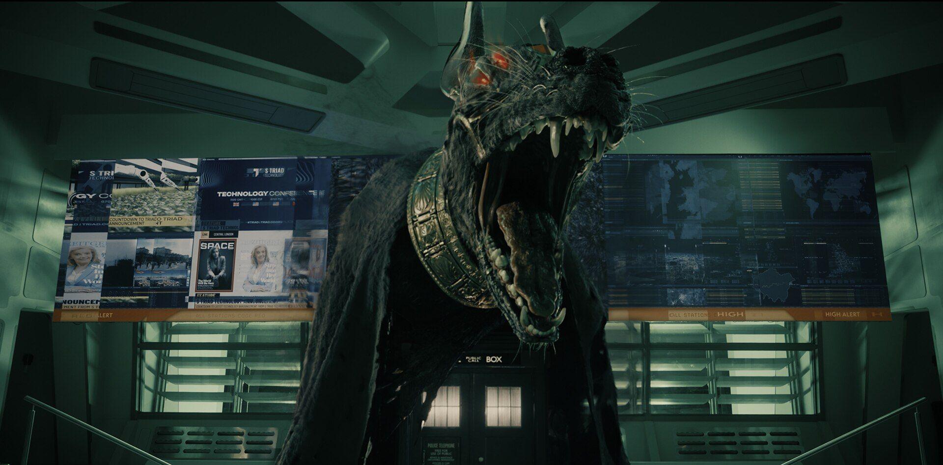 Image of a large dog-headed figure sitting on top of the TARDIS