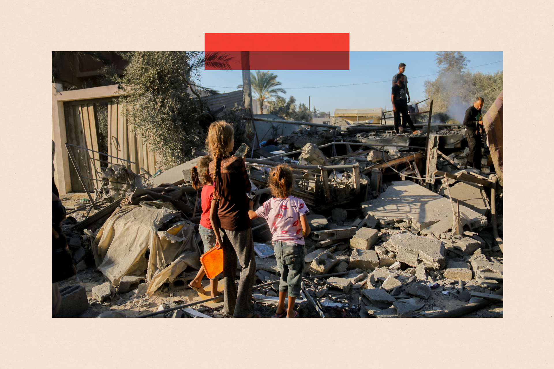 Palestinian children amongst the debris following an Israeli airstrike in Deir al-Balah, central Gaza