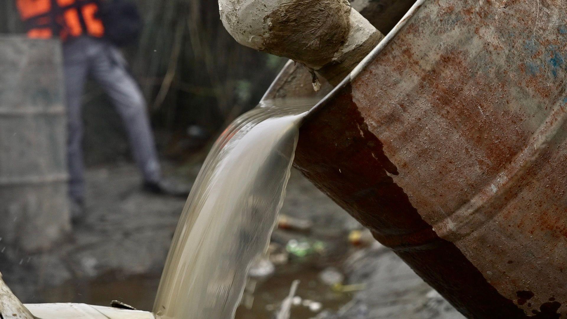 Low-quality alcohol flowing from a drum found during a police raid in Bihar state.