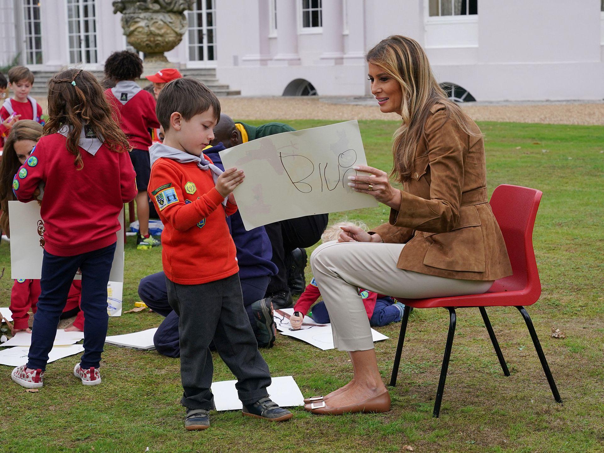First Lady Melania Trump meets members of the Scouts' Squirrels programme in Frogmore Gardens in Windsor