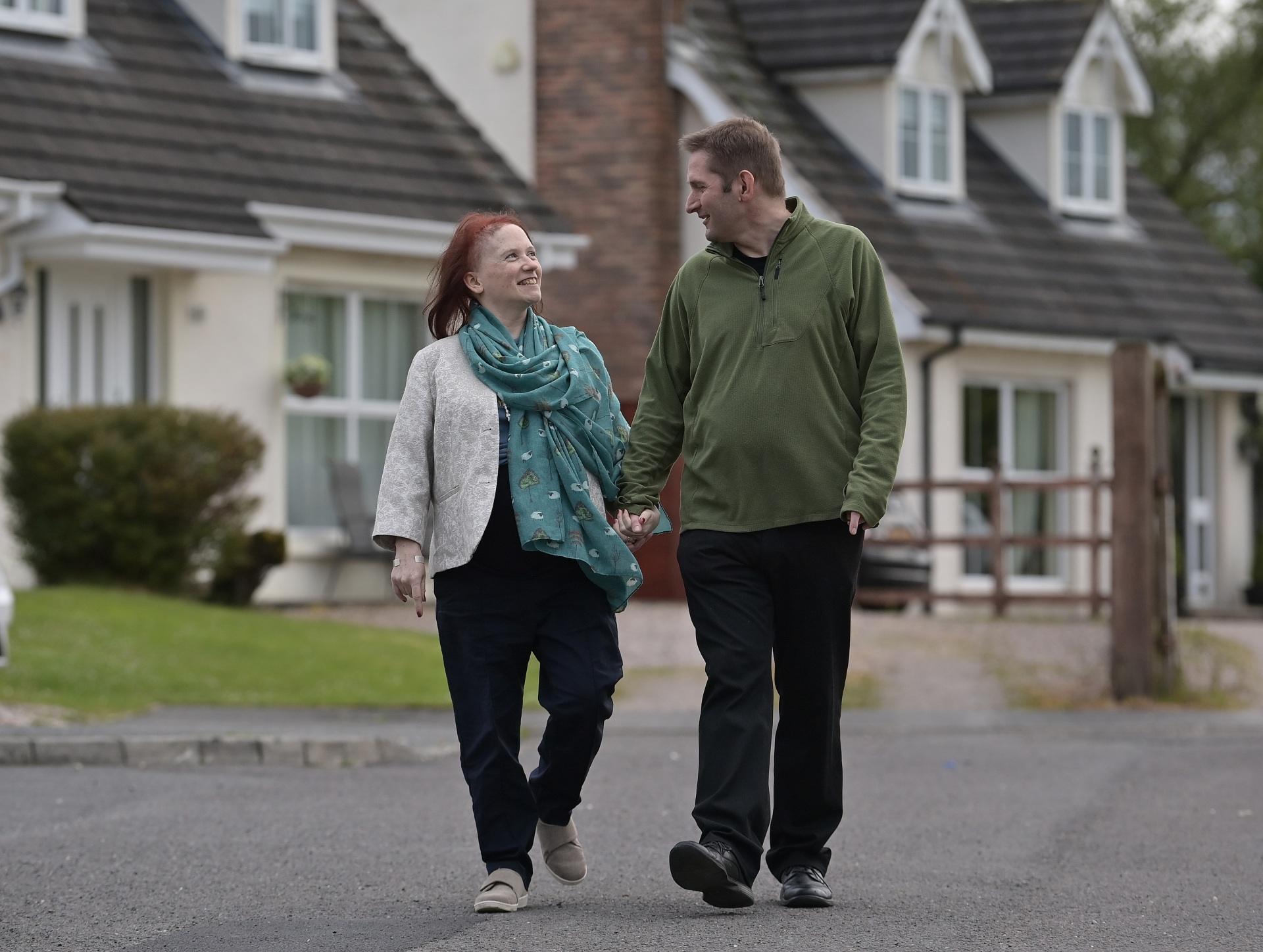 Heather and Adriaan walking near their home