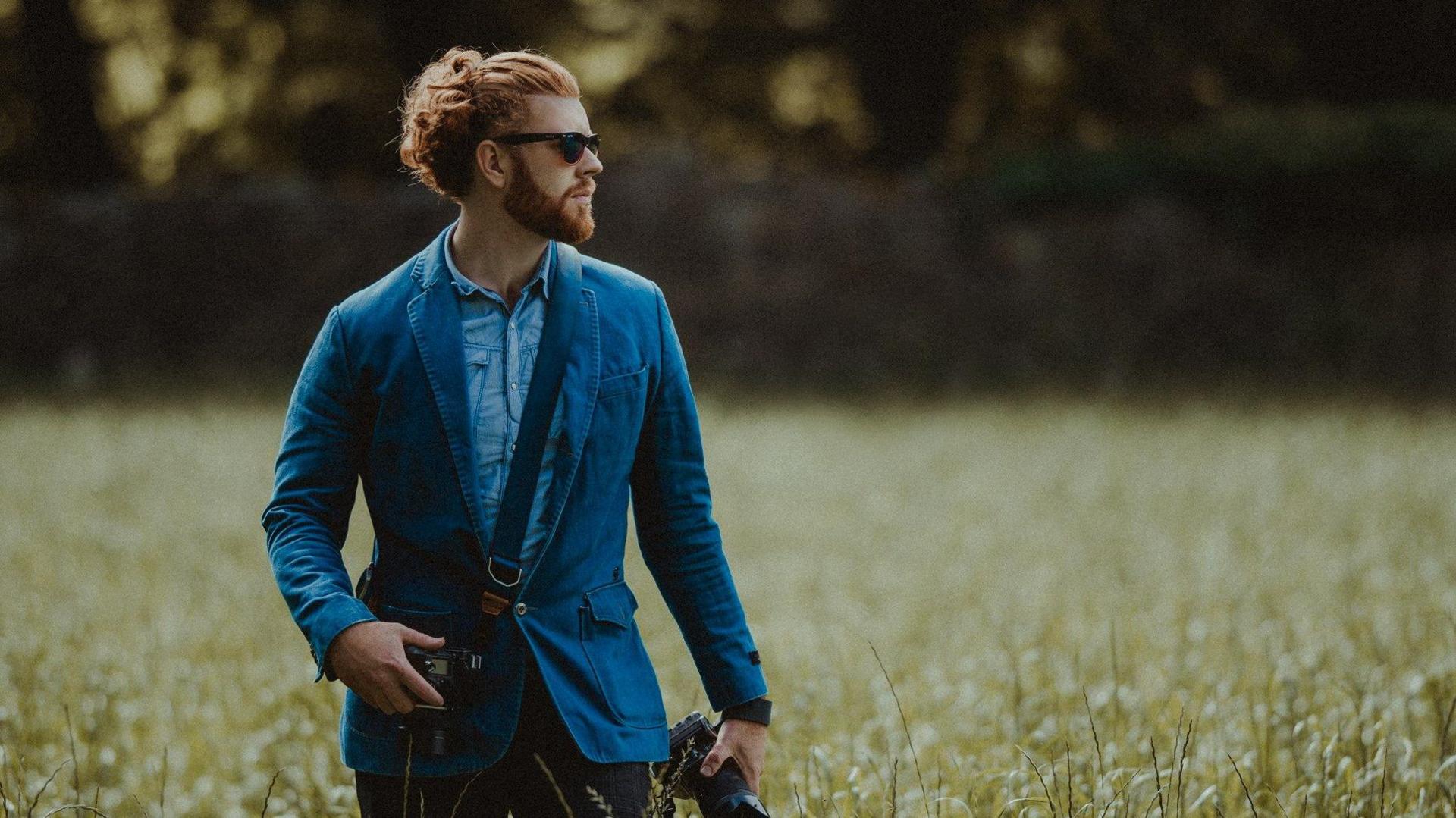 Christian O'Reilly holding a camera