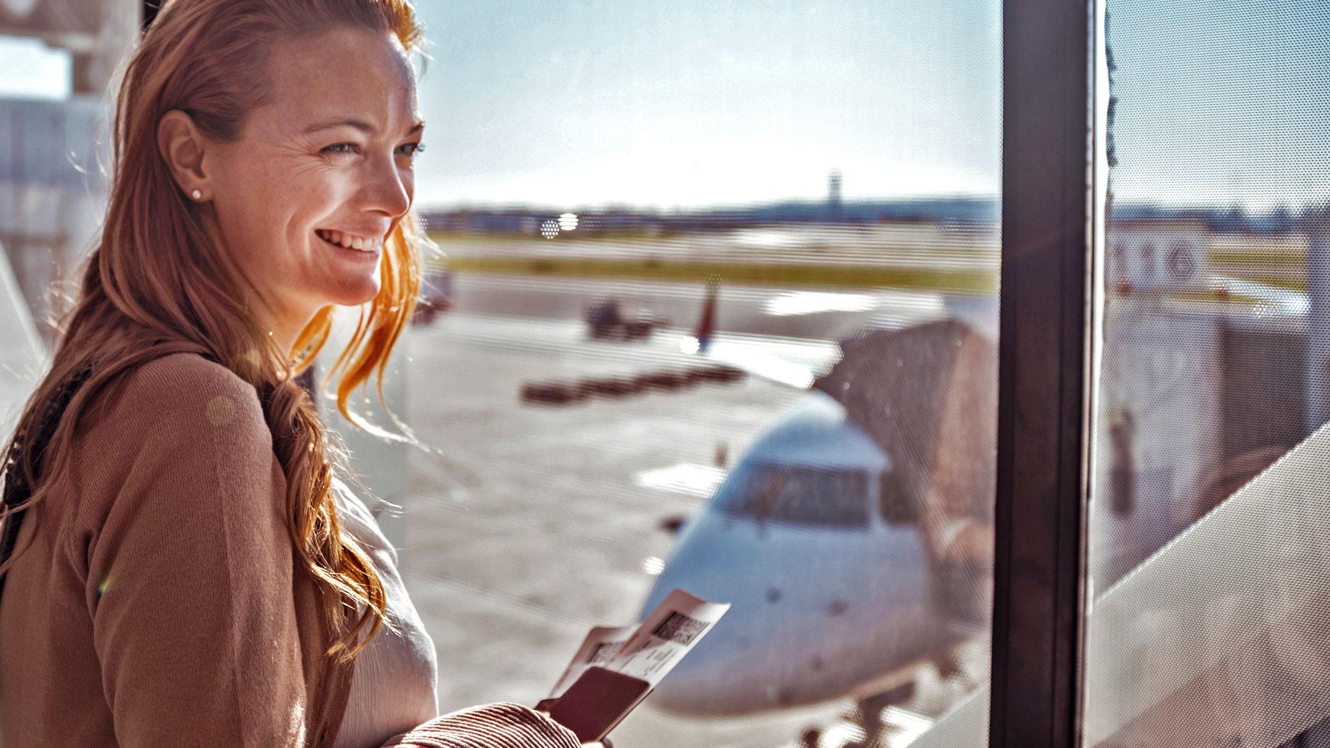 Smiling woman with passport