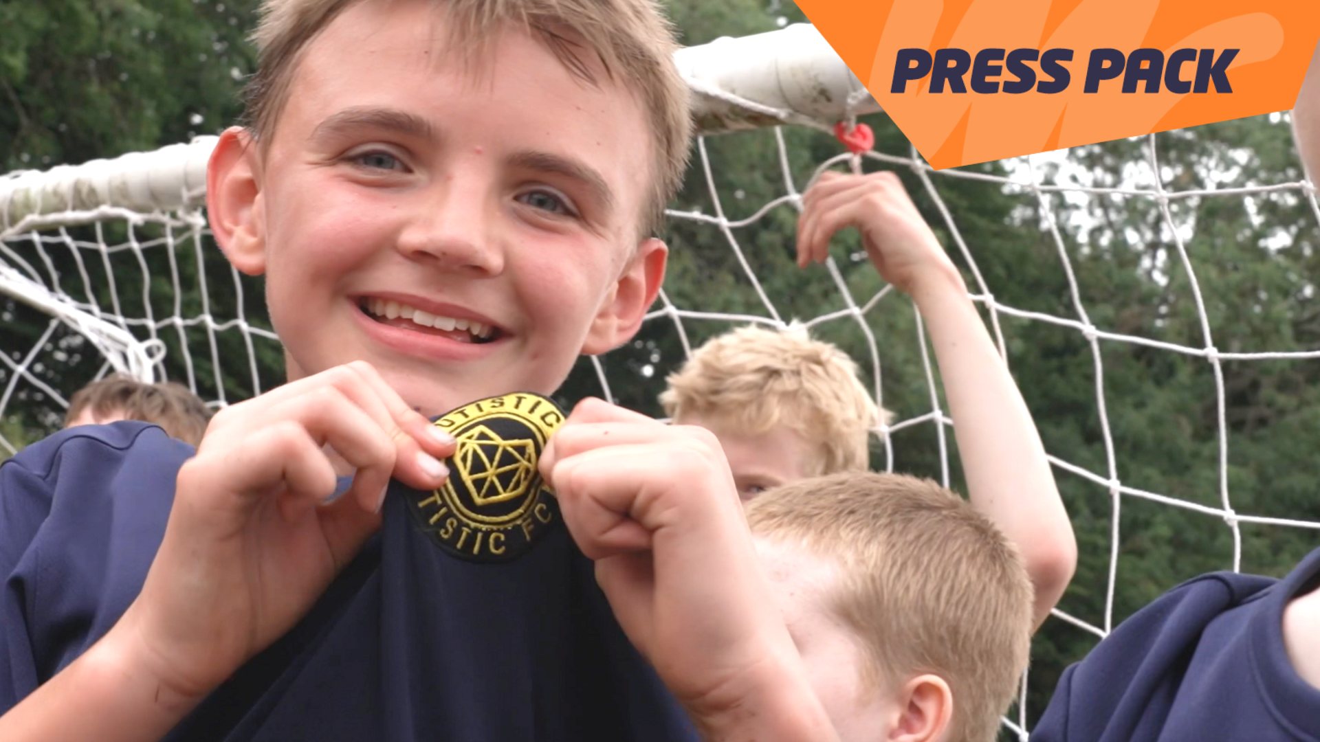 Charlie showing off his Autistic FC badge