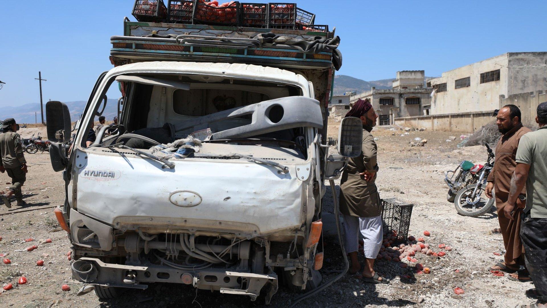 Aftermath of reported Russian air strike on a site next to a vegetable market, outside the opposition-held town of Jisr al-Shughour, Syria (25 June 2023)