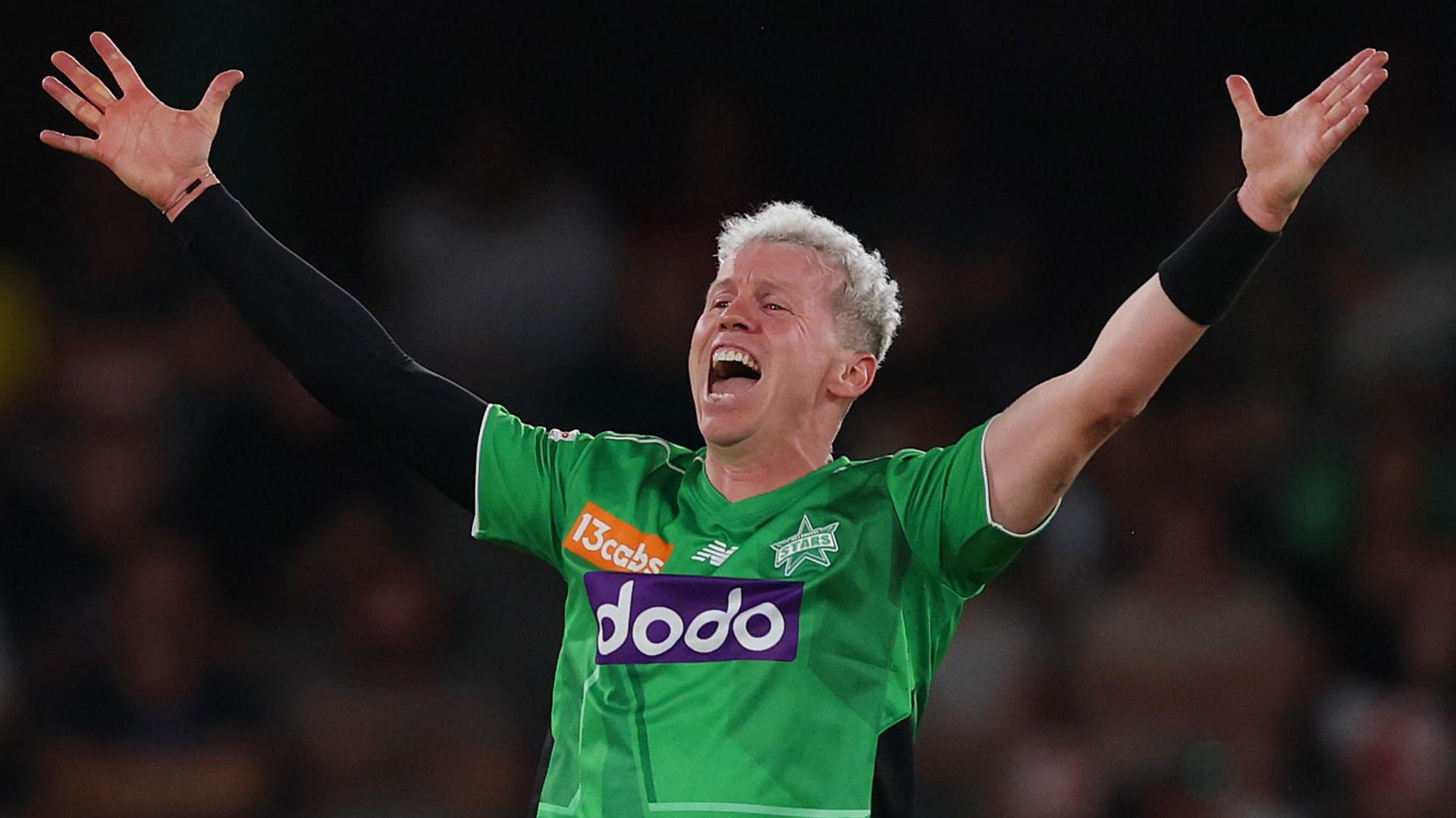Peter Siddle with his hands in the air as he celebrates taking a wicket for Melbourne in the Big Bash League