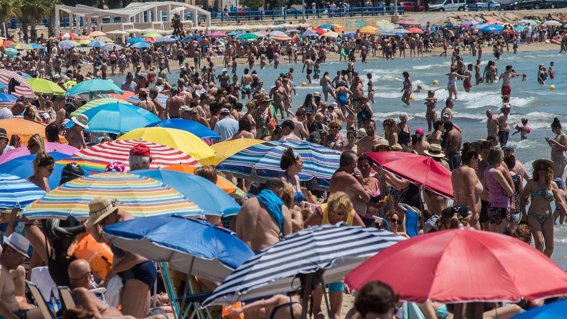 Parasols on a crowded beach