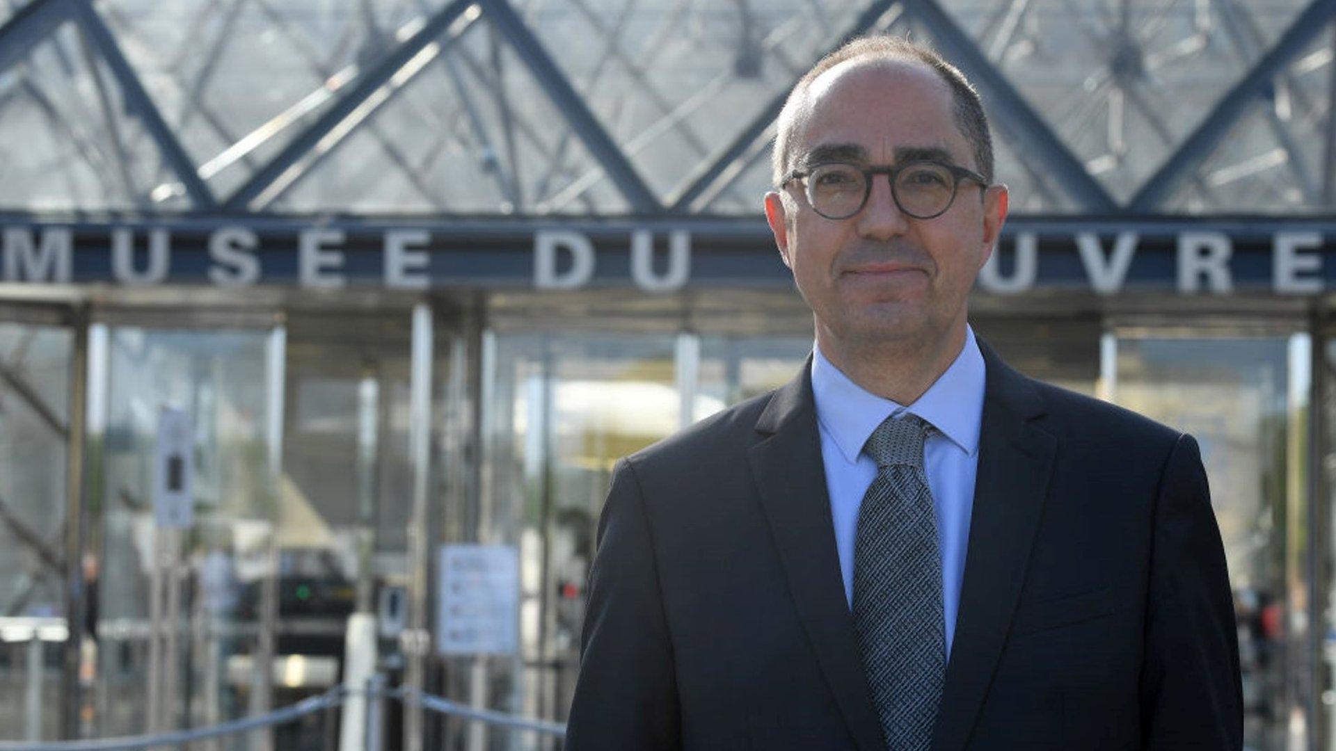 Jean-Luc Martinez pictured outside the Louvre museum's glass pyramid in Paris, France (6 July 2020)