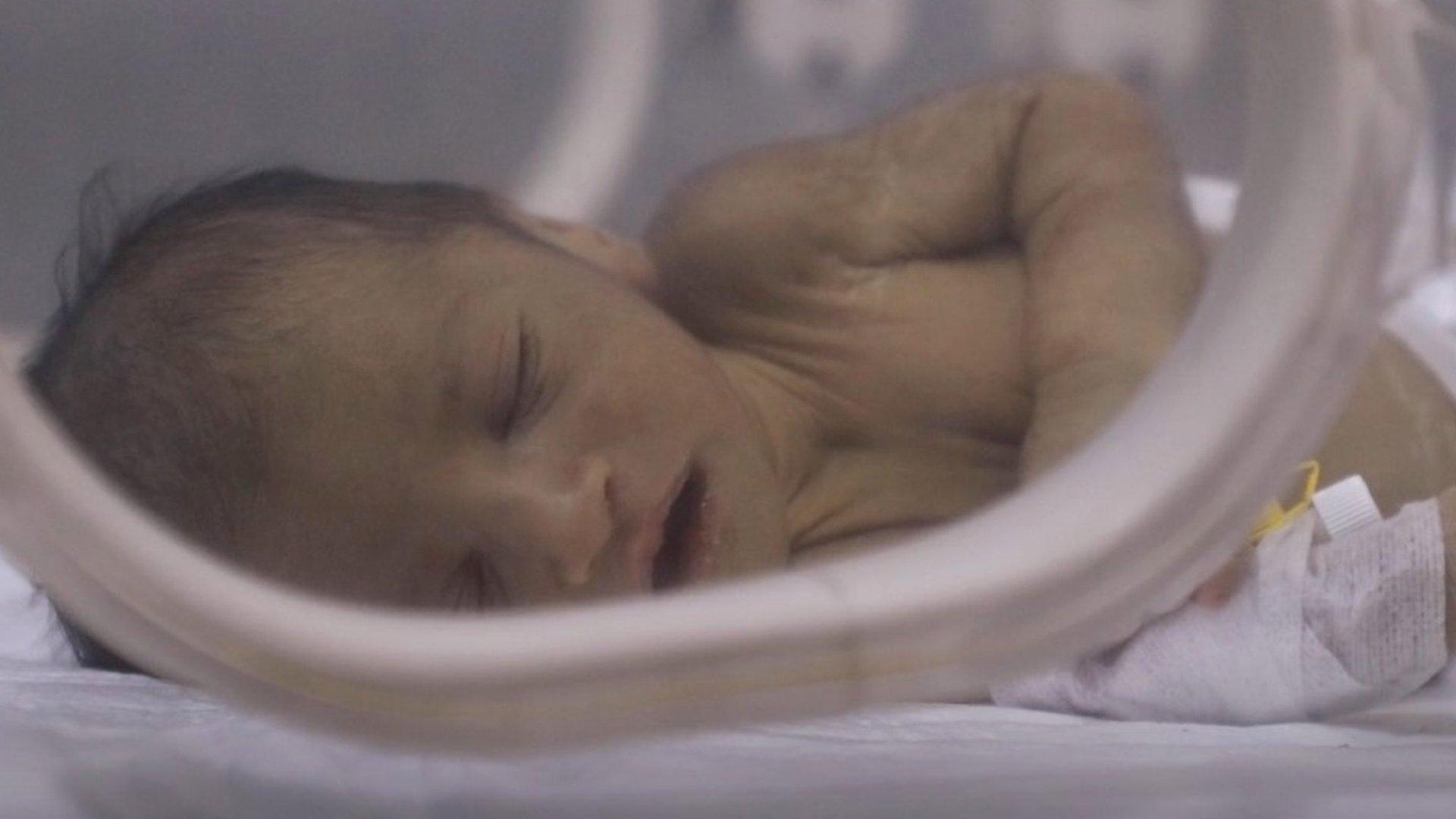 Adnan, a baby rescued from the rubble of his home in north-western Syria, sleeps inside an incubator at al-Shifa Hospital in Afrin (13 February 2023)