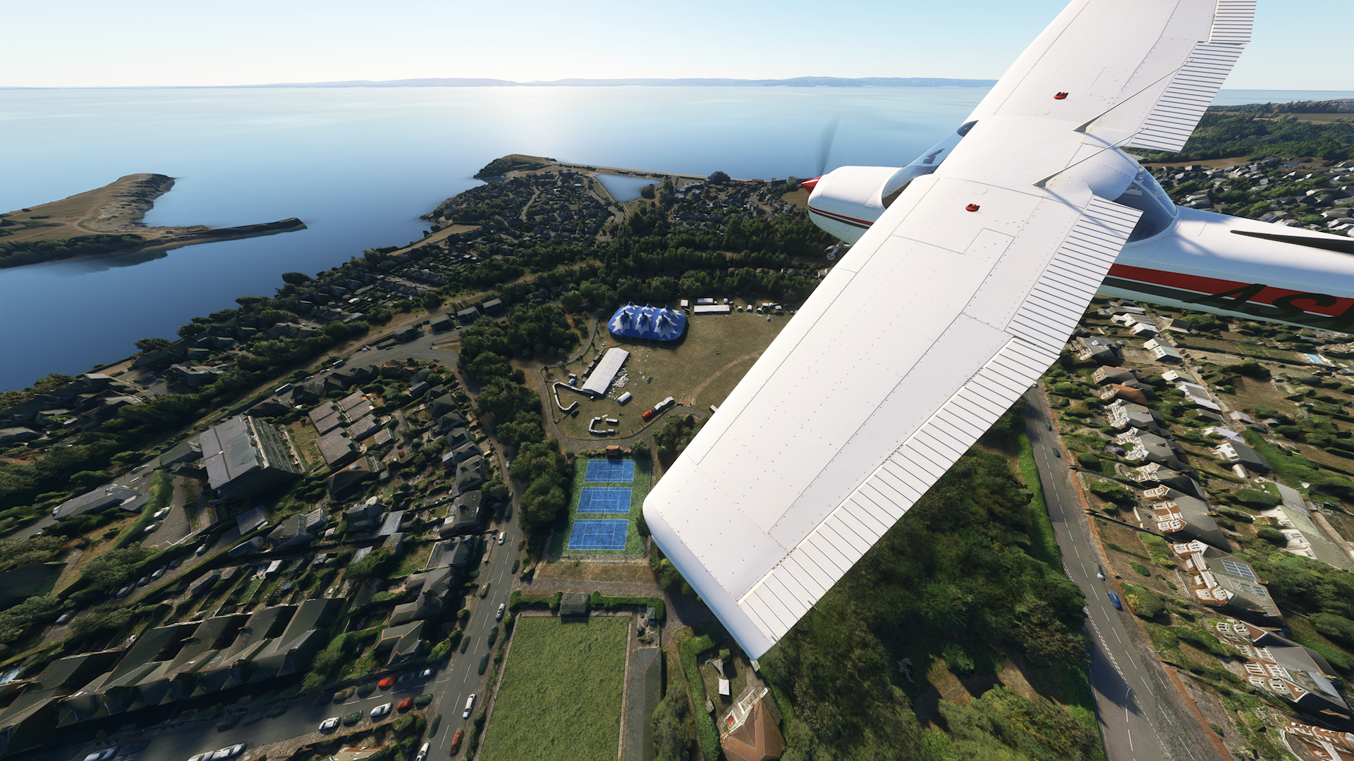 A Cessna 152 aircraft performing a flyover of Glastonbarry at Romilly Park, Barry in the video game, Microsoft Flight Simulator.