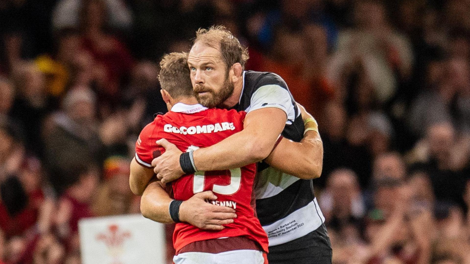 Wales' Leigh Halfpenny and Barbarians' Alun Wyn Jones embrace in Cardiff