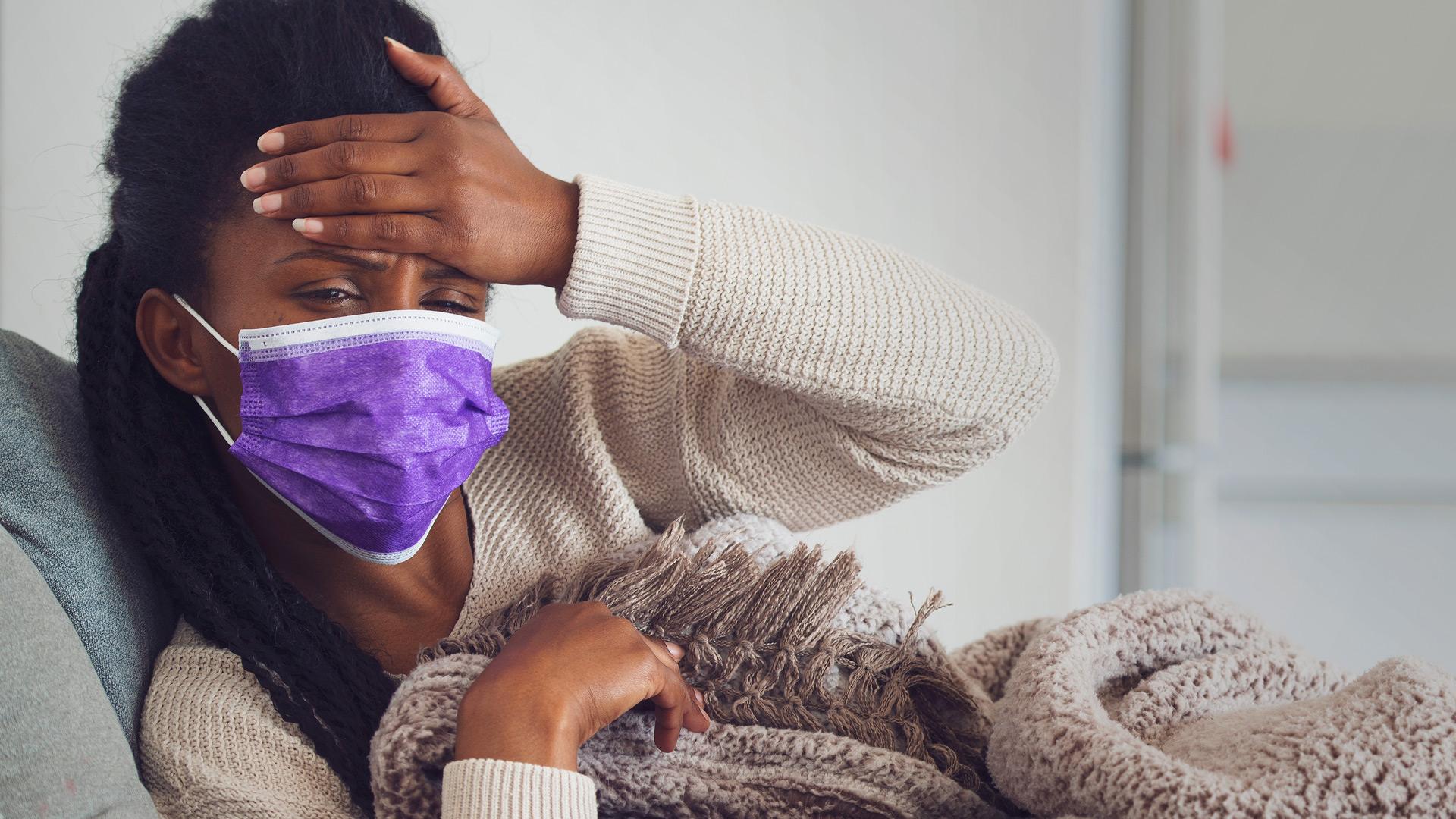 Woman with a purple face mask