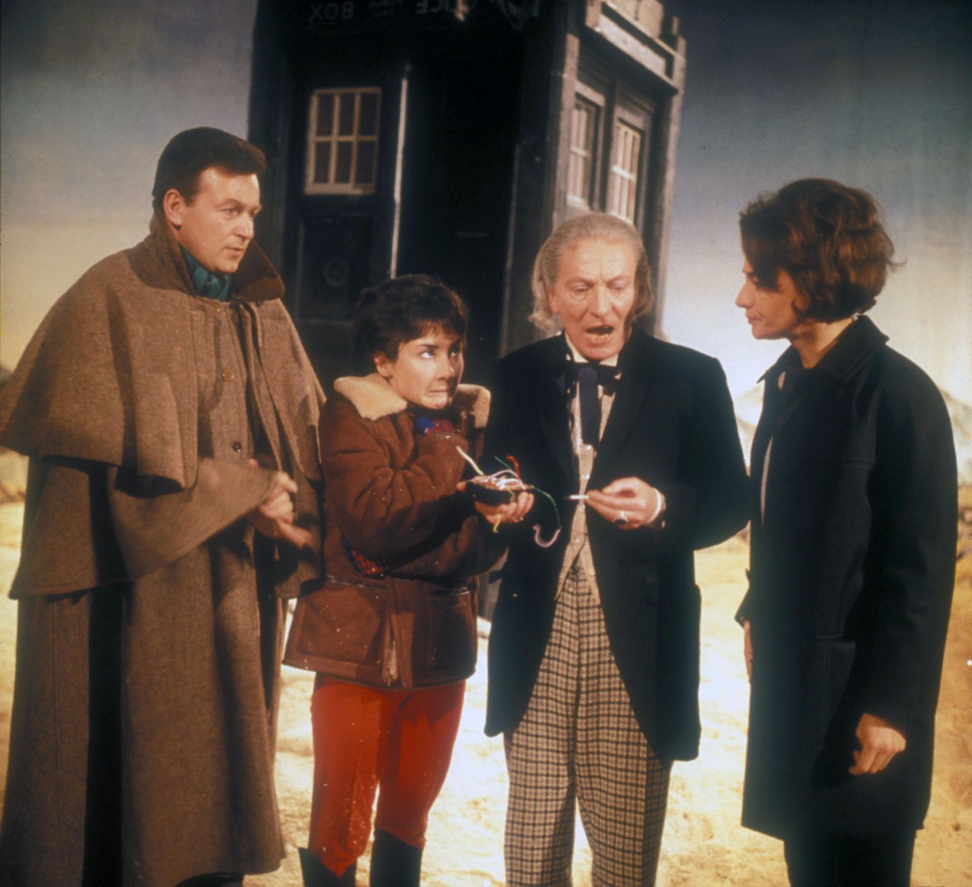 Colour photo of original Doctor Who cast William Russell, Carole Ann Ford, William Hartnell and Jacqueline Hill, standing outside of the TARDIS