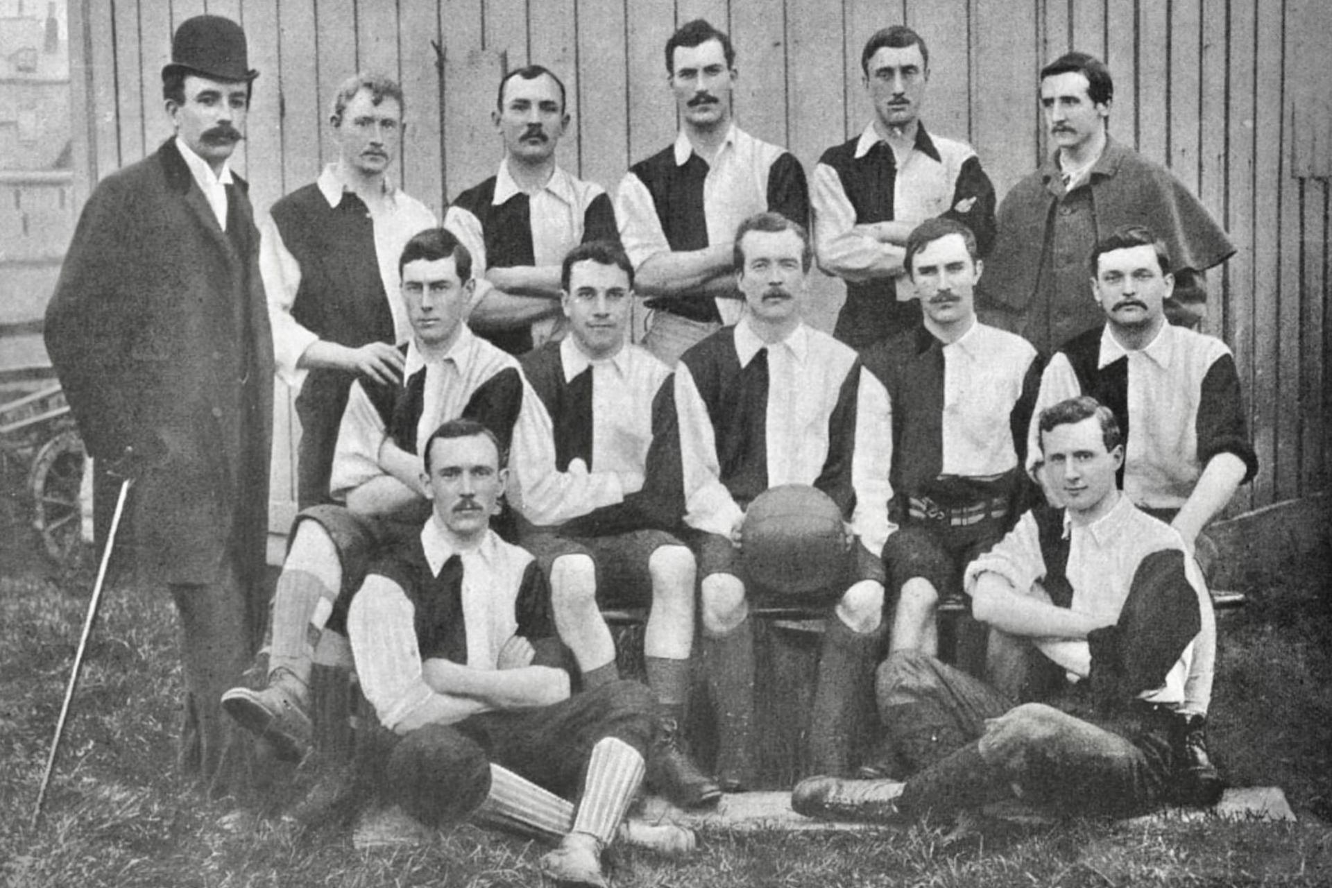 Black and white team photo of a football team