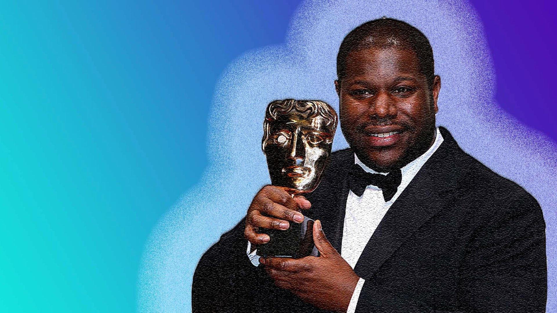 Steve McQueen holding a BAFTA Award