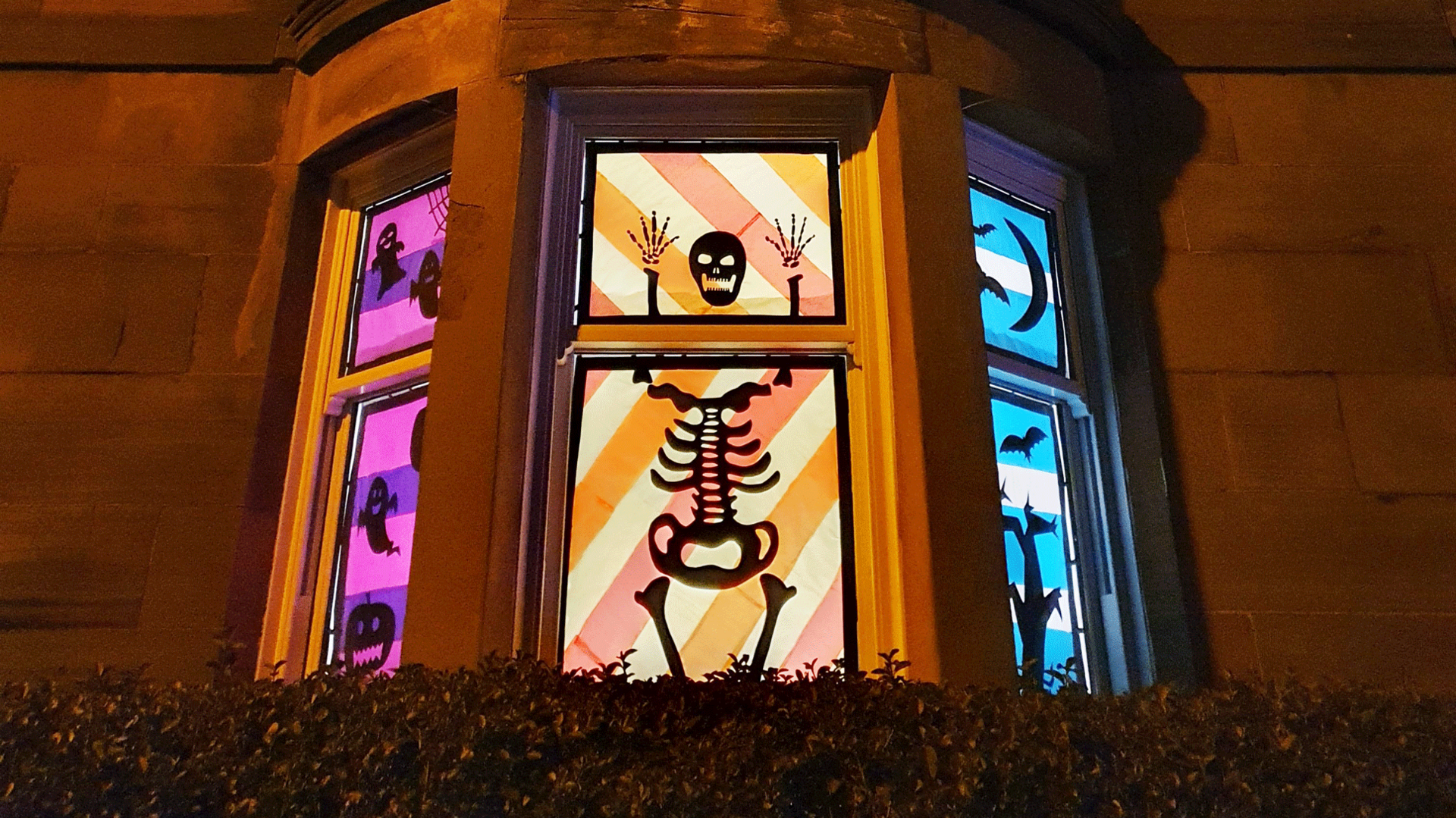 Skeleton figure in tenement window