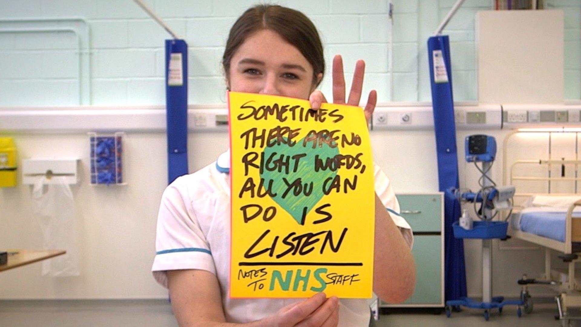 Student nurse holding poster