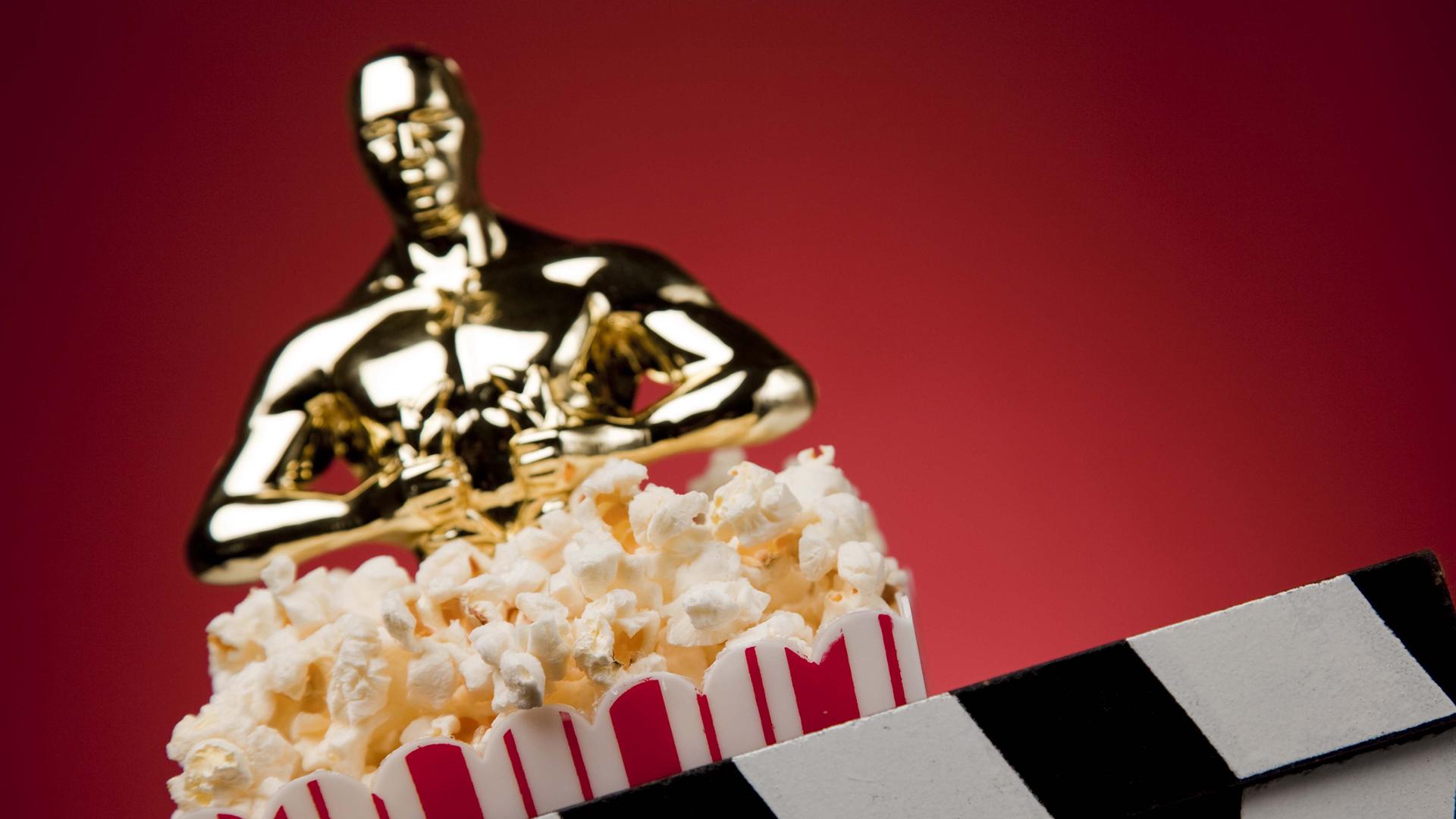 Oscars statue with some popcorn