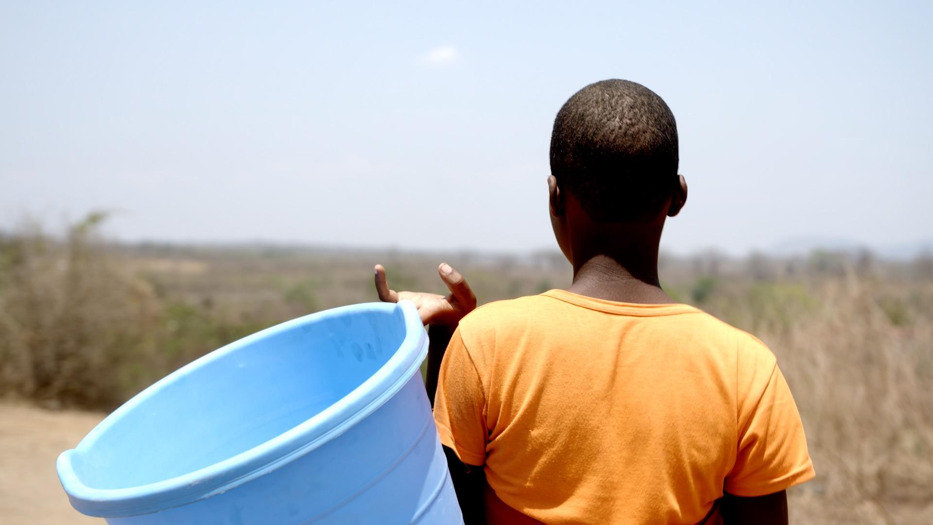 Tamara working in the fields as a pregnant 13-year-old