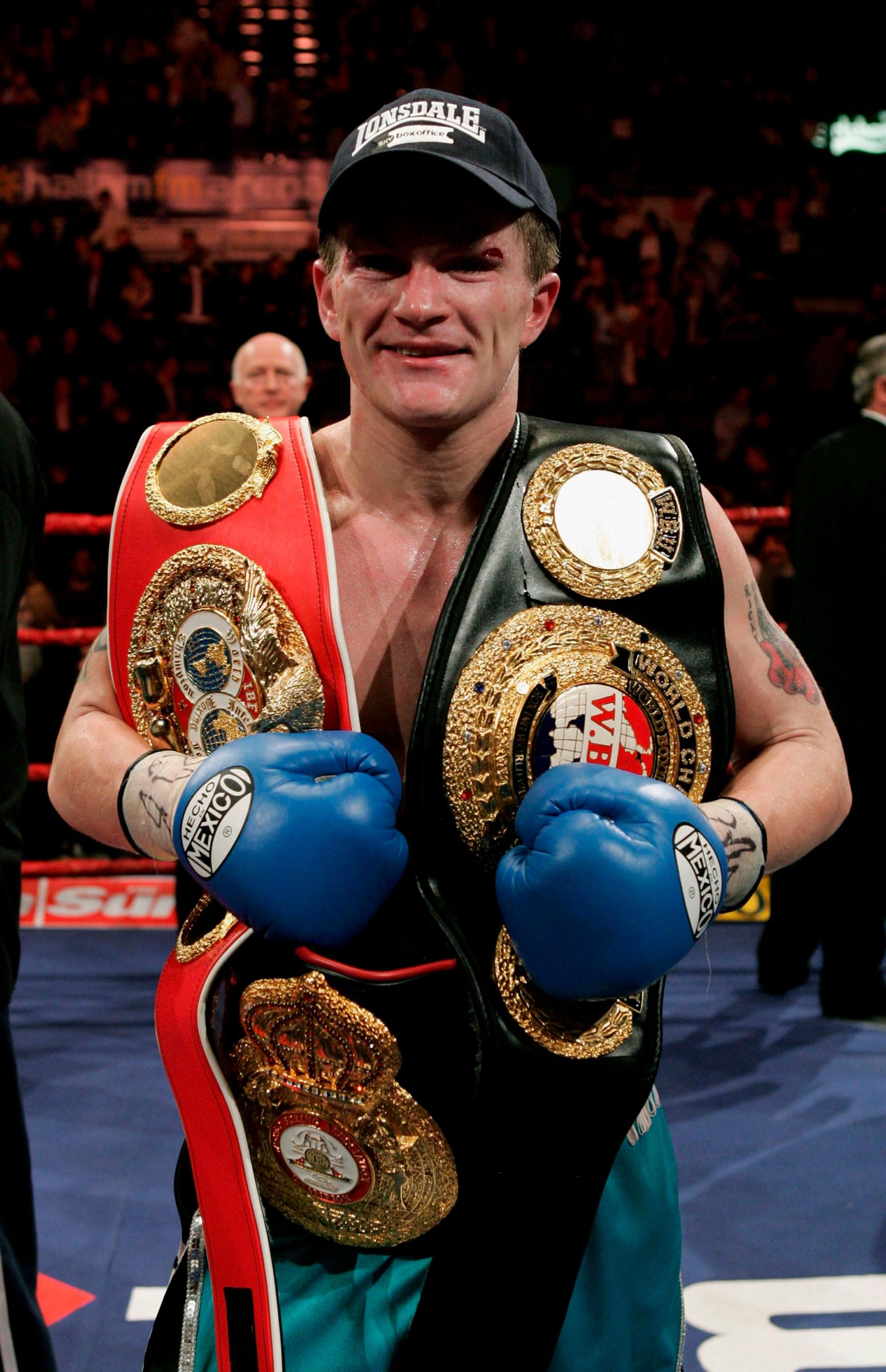 Ricky Hatton with boxing belts