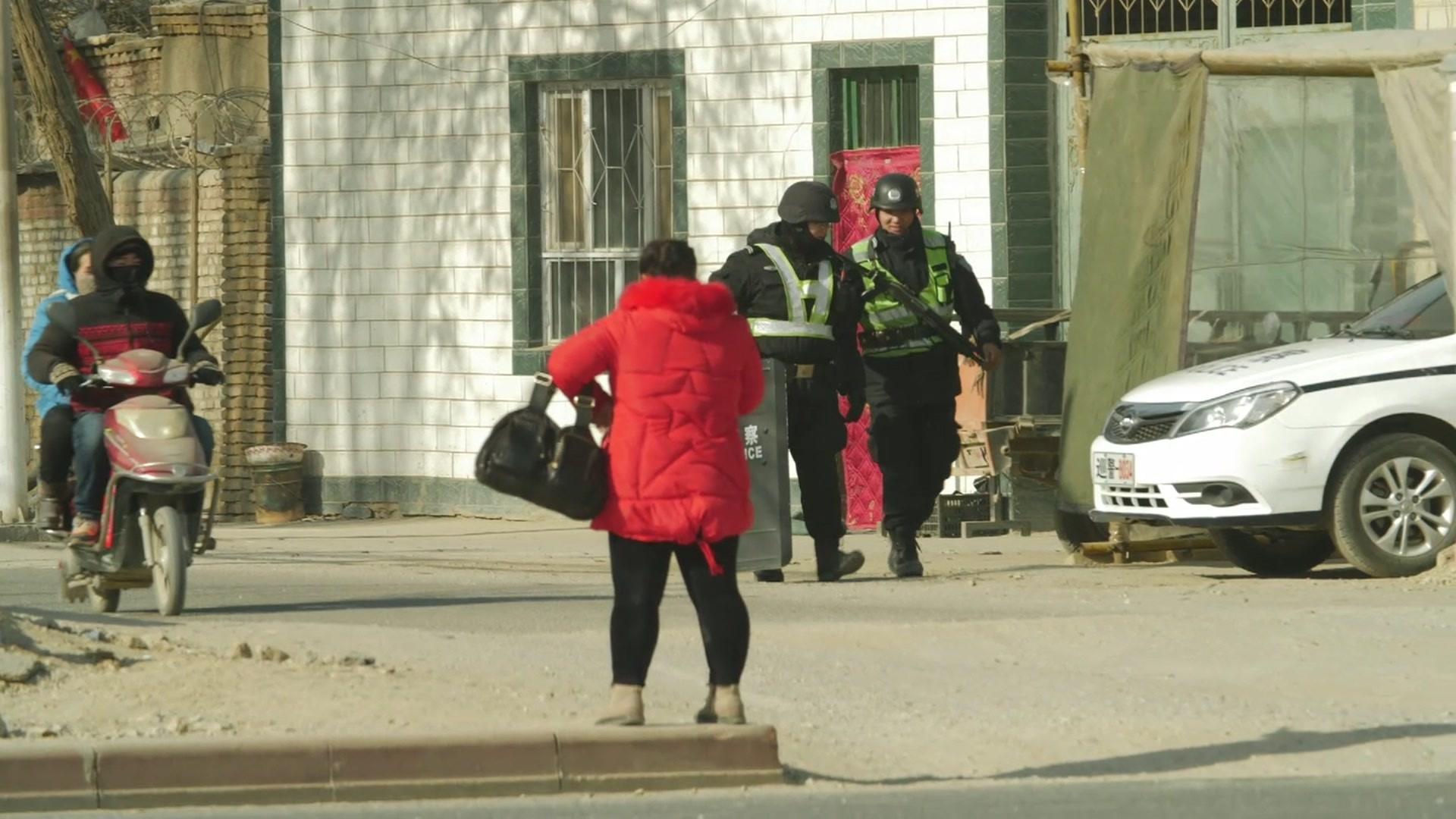 Uighurs and police in Xinjiang, January 2018