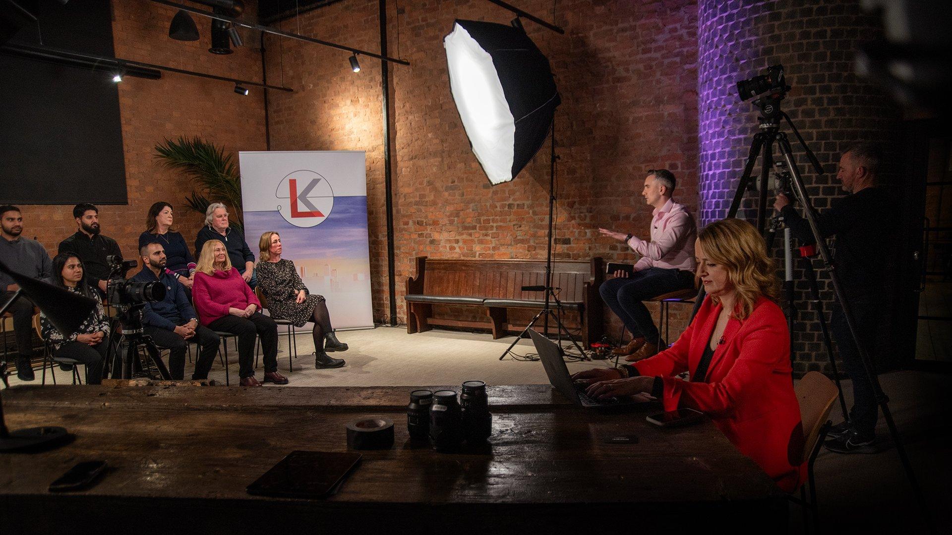 Members of the public participate in a studio discussion