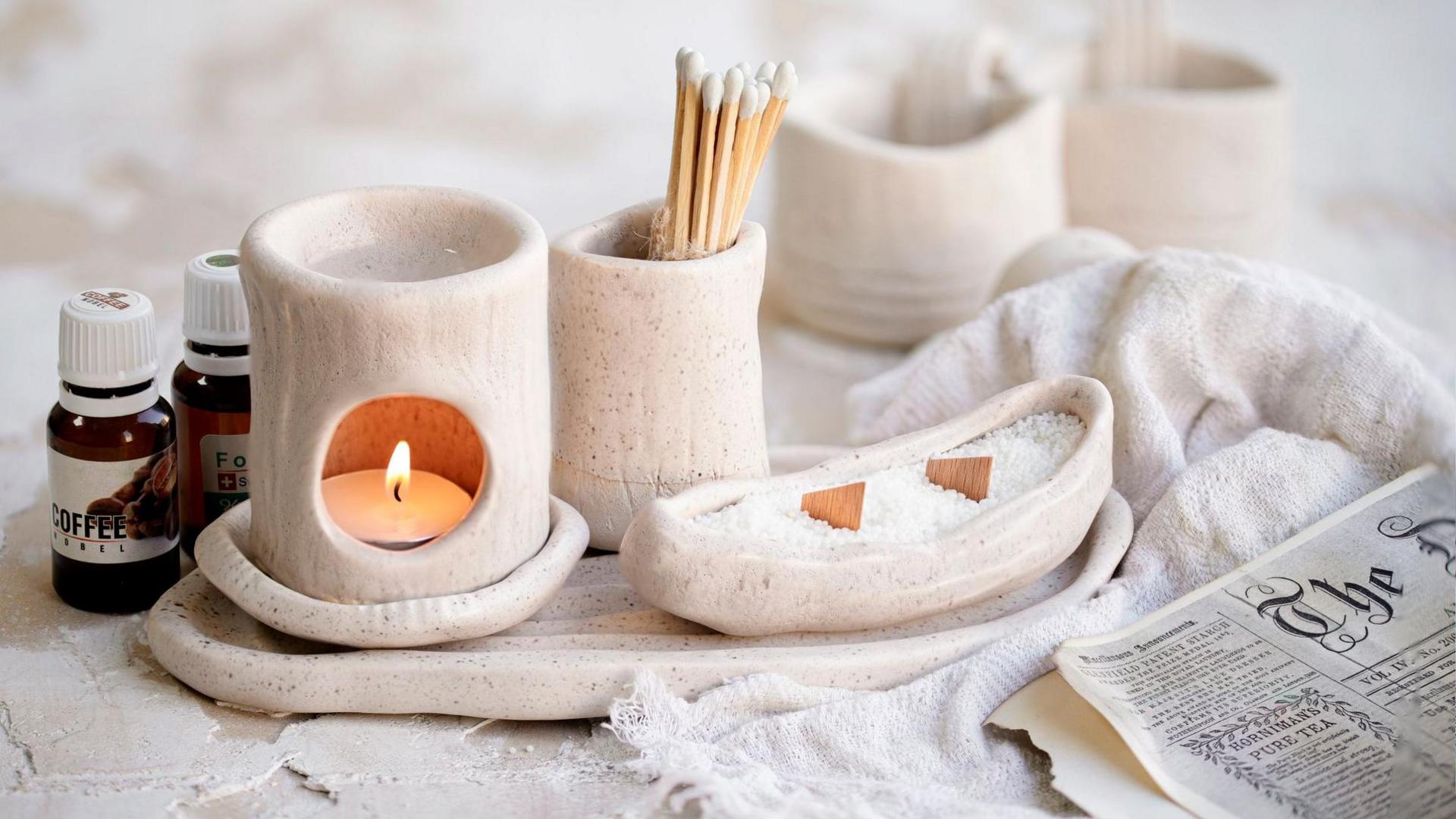 An oil burner with matches and a news paper