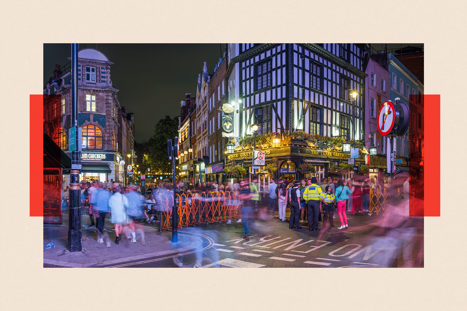 London Soho nightlife showing crowds of people outside busy pubs 