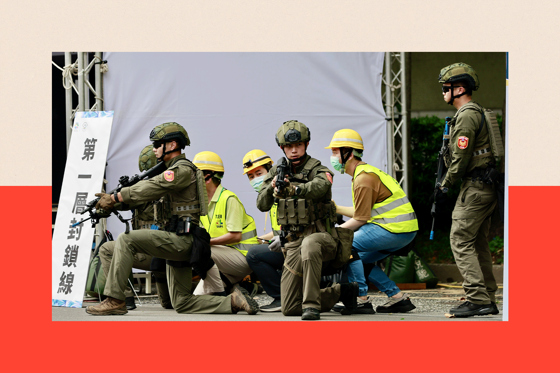Rescuers and volunteers secure a telecommunication facility as they participate in the Urban Resilience Exercise after the air raid drill, as part of the annual Han Kuang military exercises, in Taipei, Taiwan