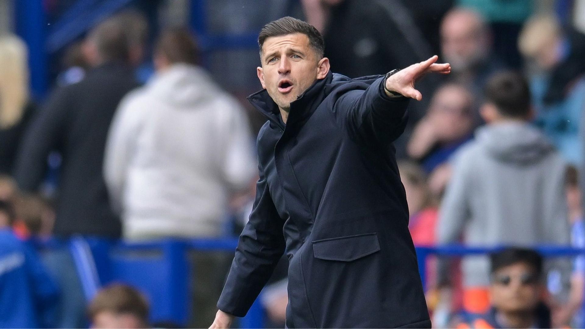 Portsmouth boss John Mousinho gesticulates from the touchline