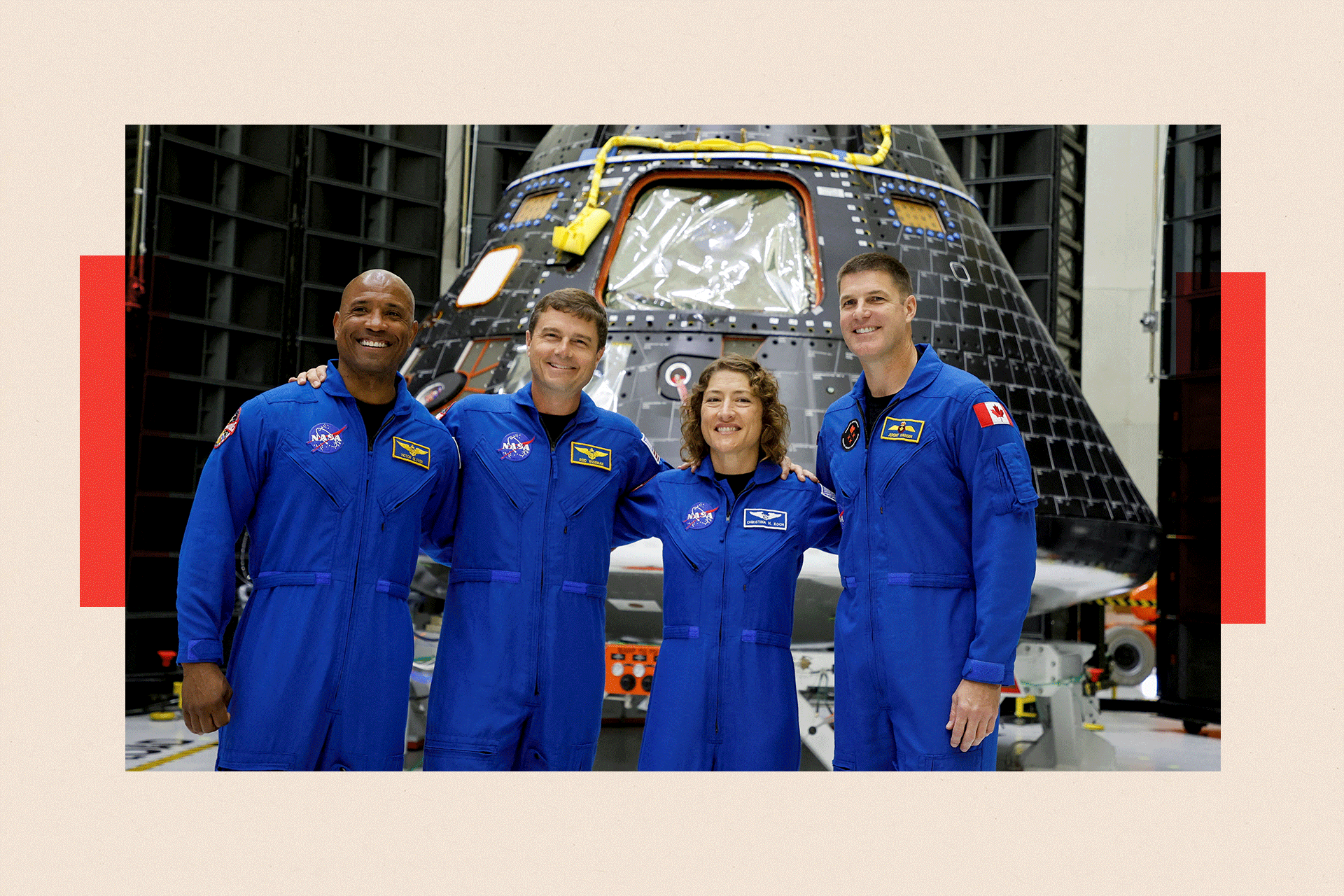 Four Astronauts in blue NASA uniforms, smiling at a press conference 