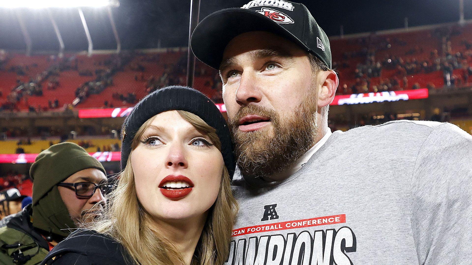 Taylor Swift and Travis Kelce of the Kansas City Chiefs embrace at Arrowhead Stadium on January 26, 2025 in Kansas City, Missouri.
