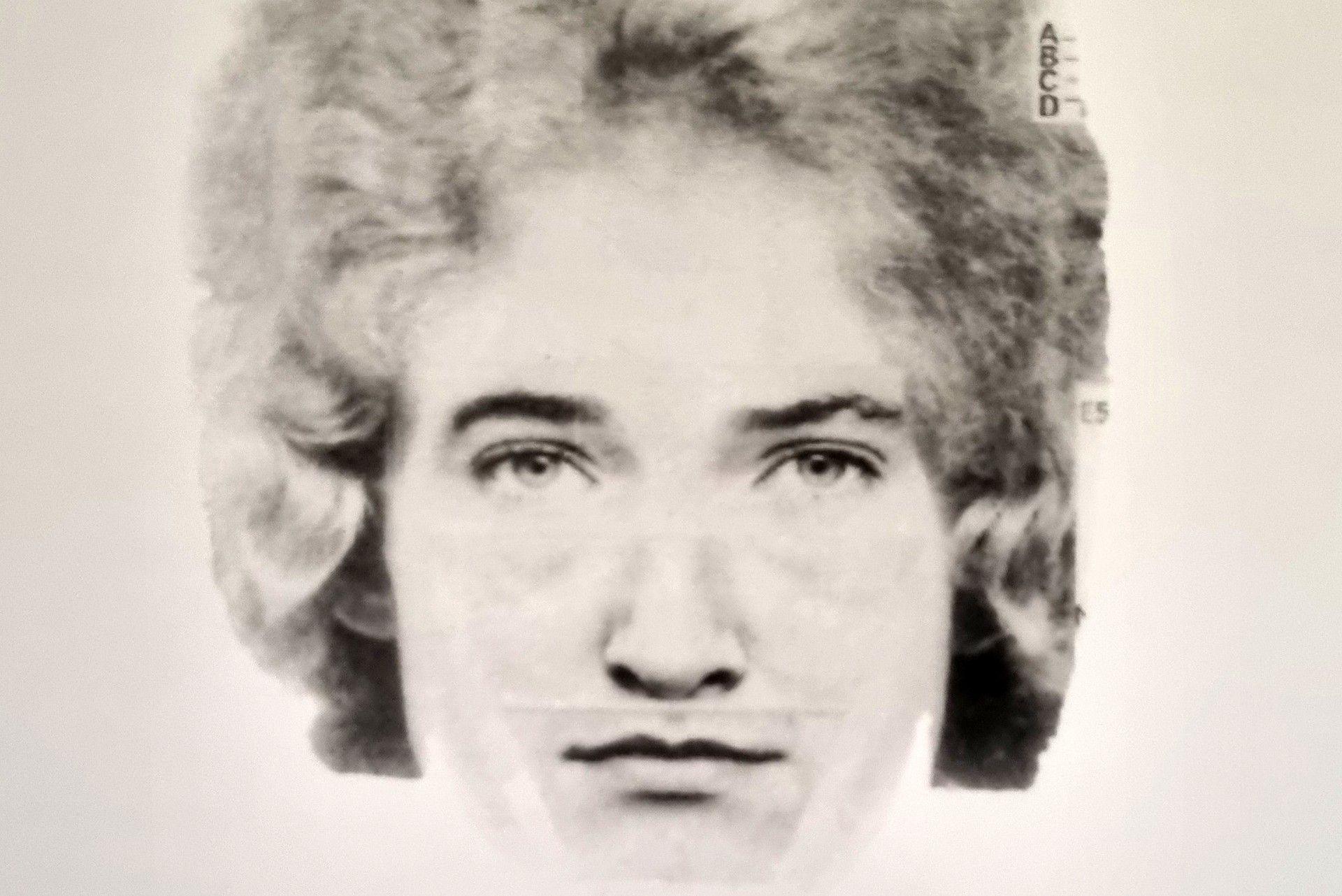 A black and white police photofit of the suspect in the Mary McLaughlin murder. He has piercing eyes and blonde bushy hair.