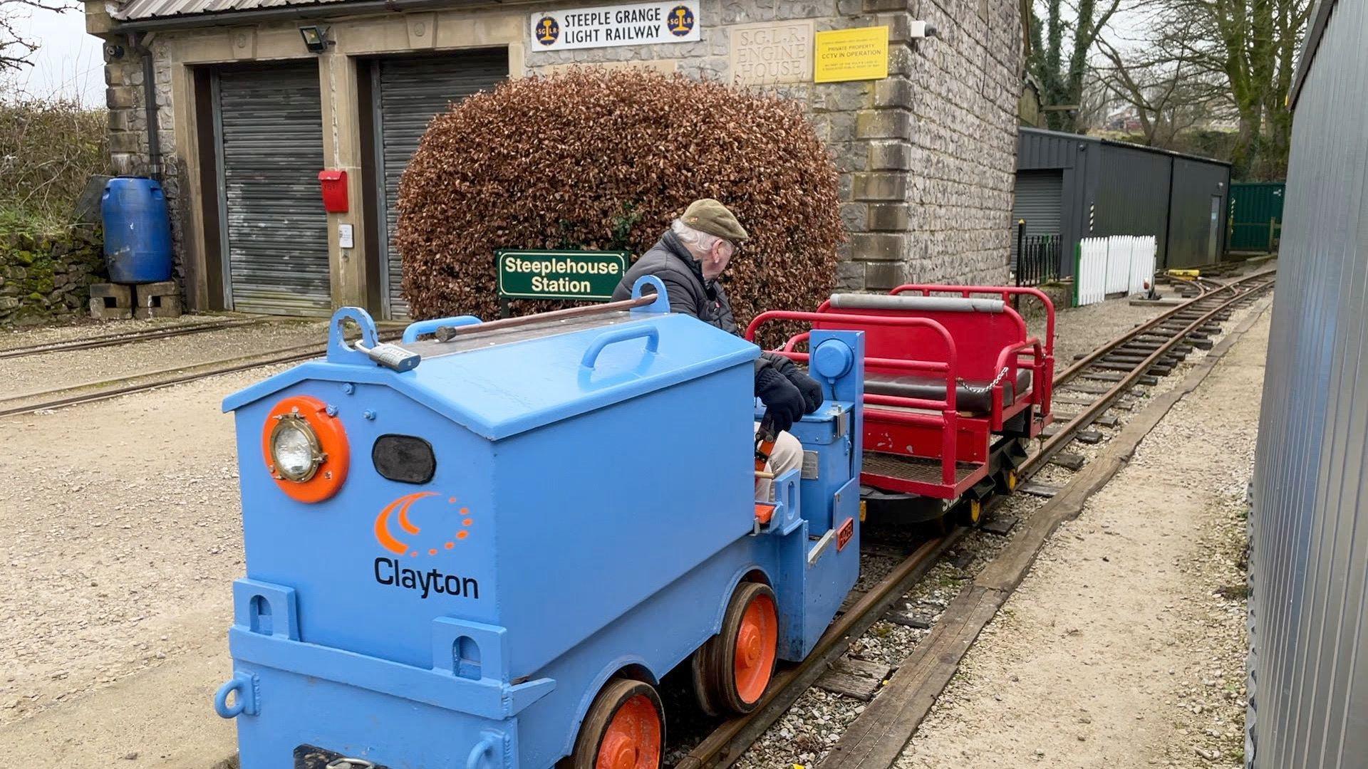 Jim Goldsmith driving the loco out of the station