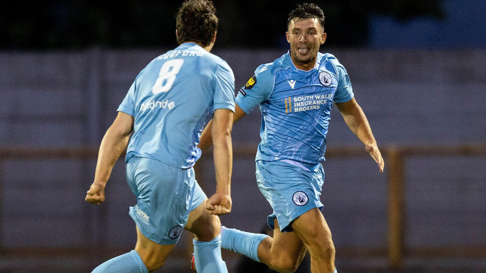 Liam Eason celebrates after scoring for Cambrian United against Barry Town