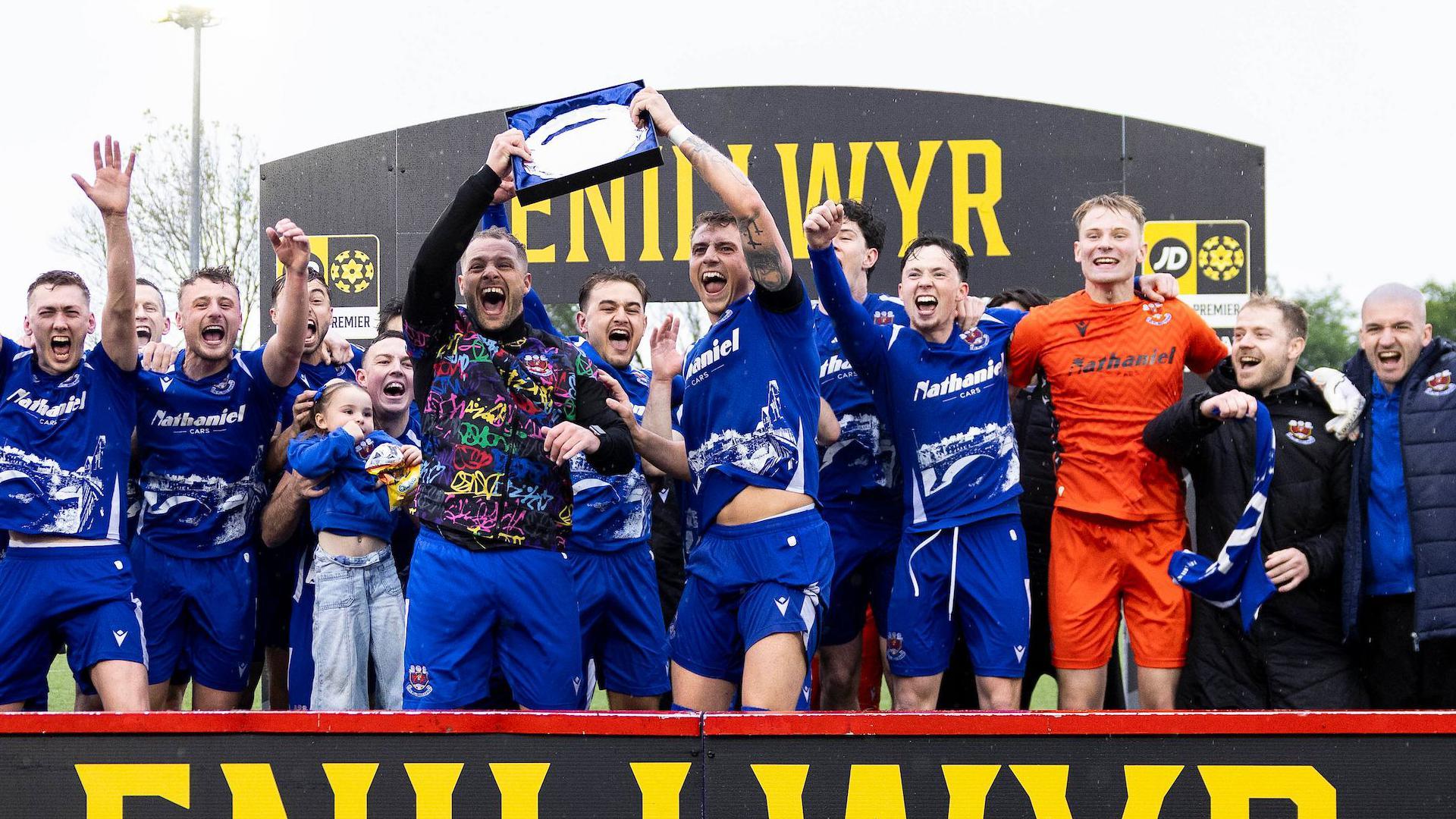 Penybont players in blue celebrate their Play-Off final win over Haverfordwest County in May