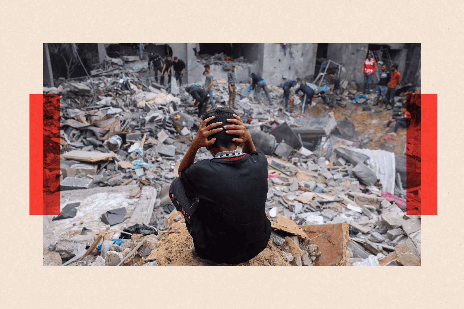 A child reacts as people salvage belongings amid the rubble of a damaged building following strikes on Rafah