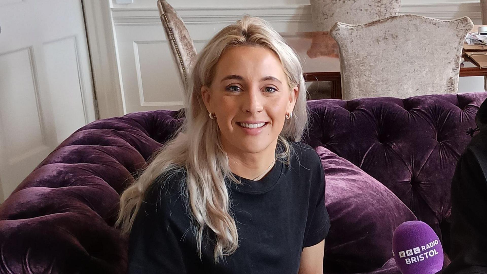 Siobhan-Marie O’Connor sitting on a sofa 