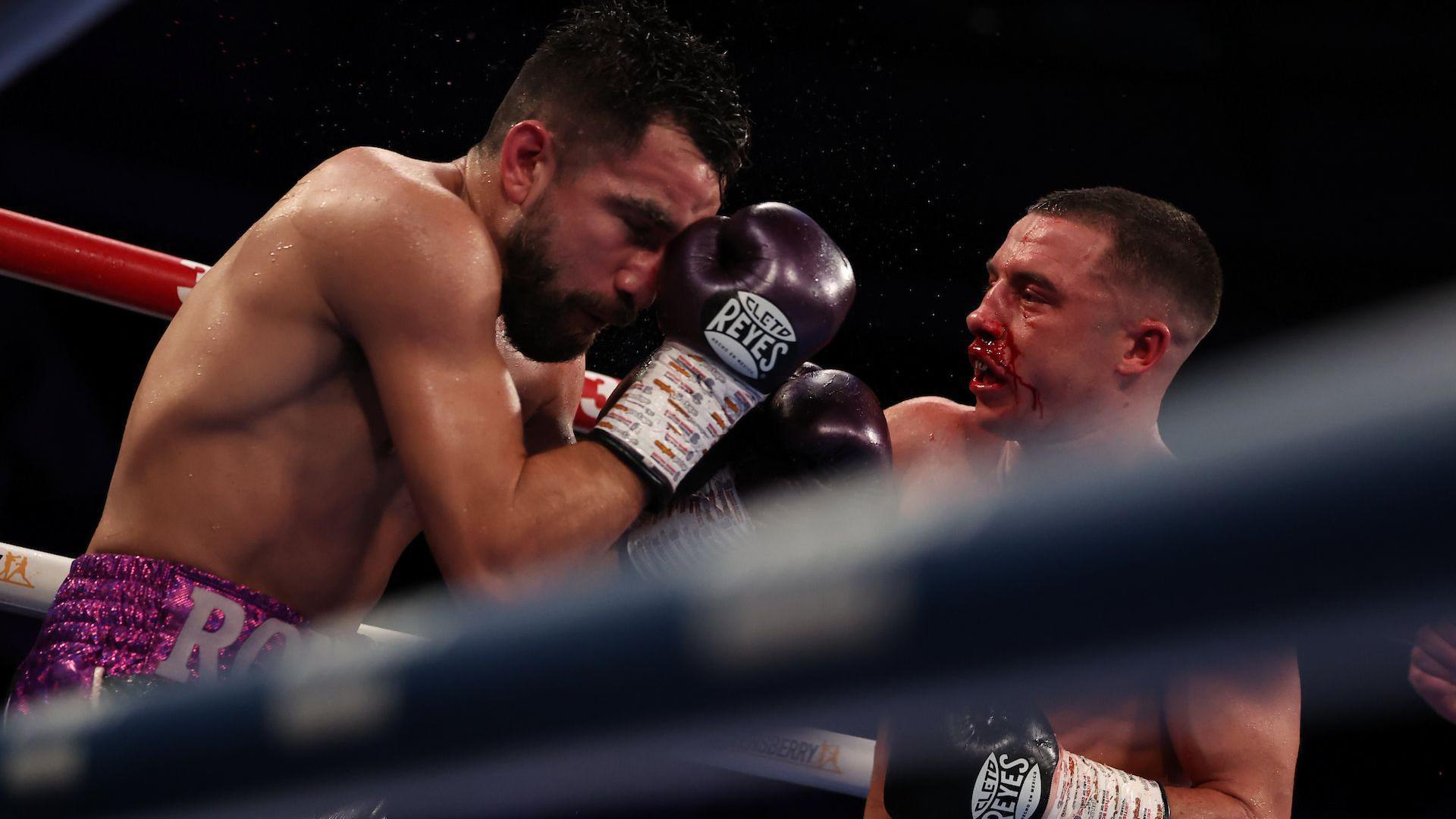 Nick Ball with a bloody nose punches Ronny Rios