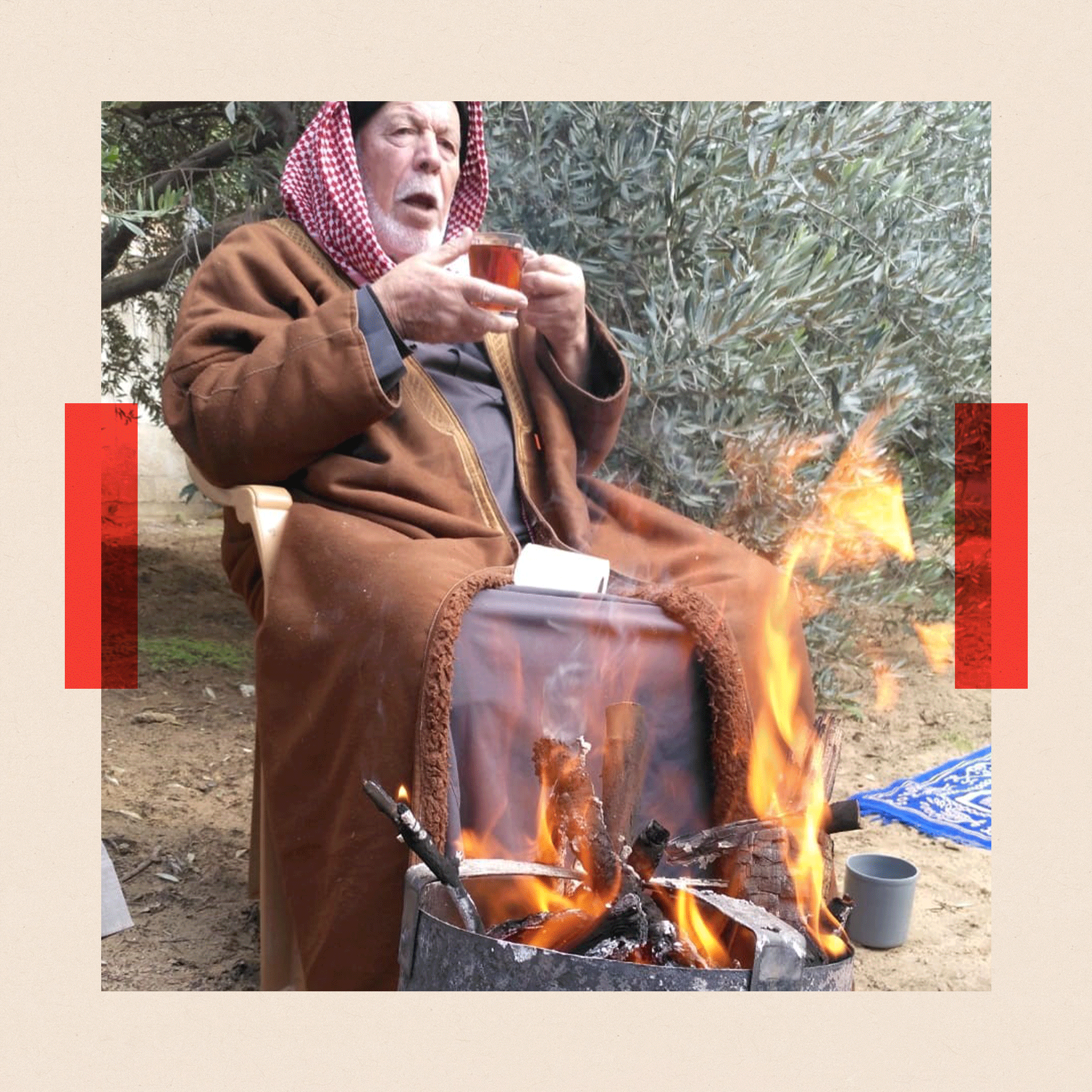 Ayish sitting by a fire
