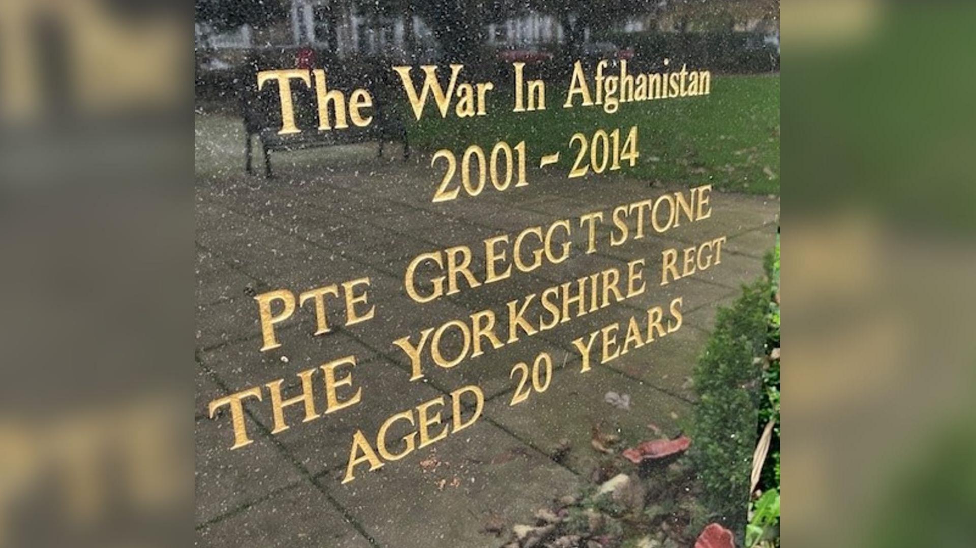 A war memorial in Hornsea, East Yorkshire. On it, written in gold lettering, are the words: The war in Afghanistan 2001 - 2014. Pte Gregg T Stone, The Yorkshire Regt (short for regiment), Aged 20 years.   