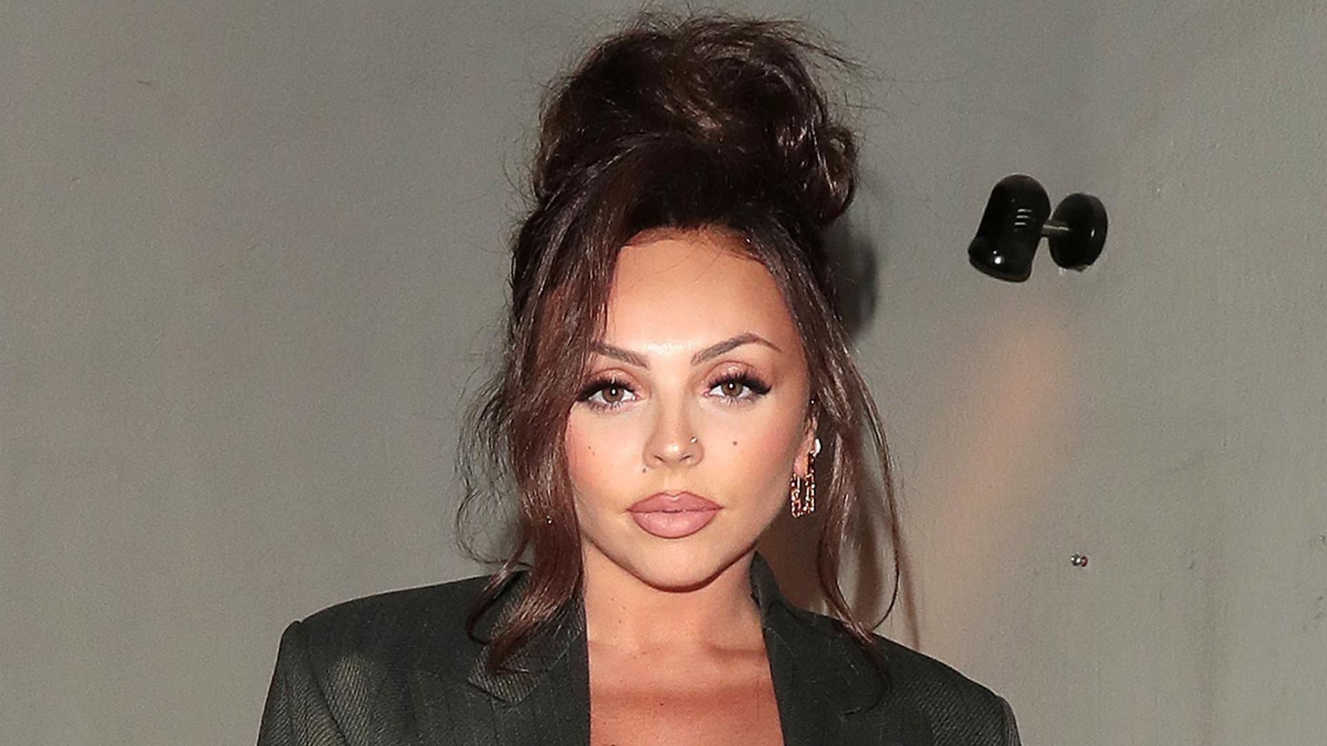 Jesy Nelson pictured in 2023, she is wearing a black jacket and had her hair up.