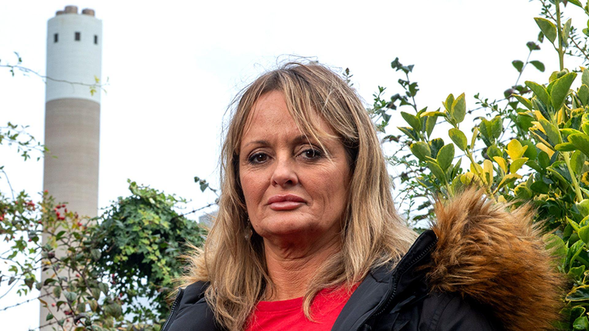 Mandy Royle stands in front of the Runcorn incinerator, which backs onto her property