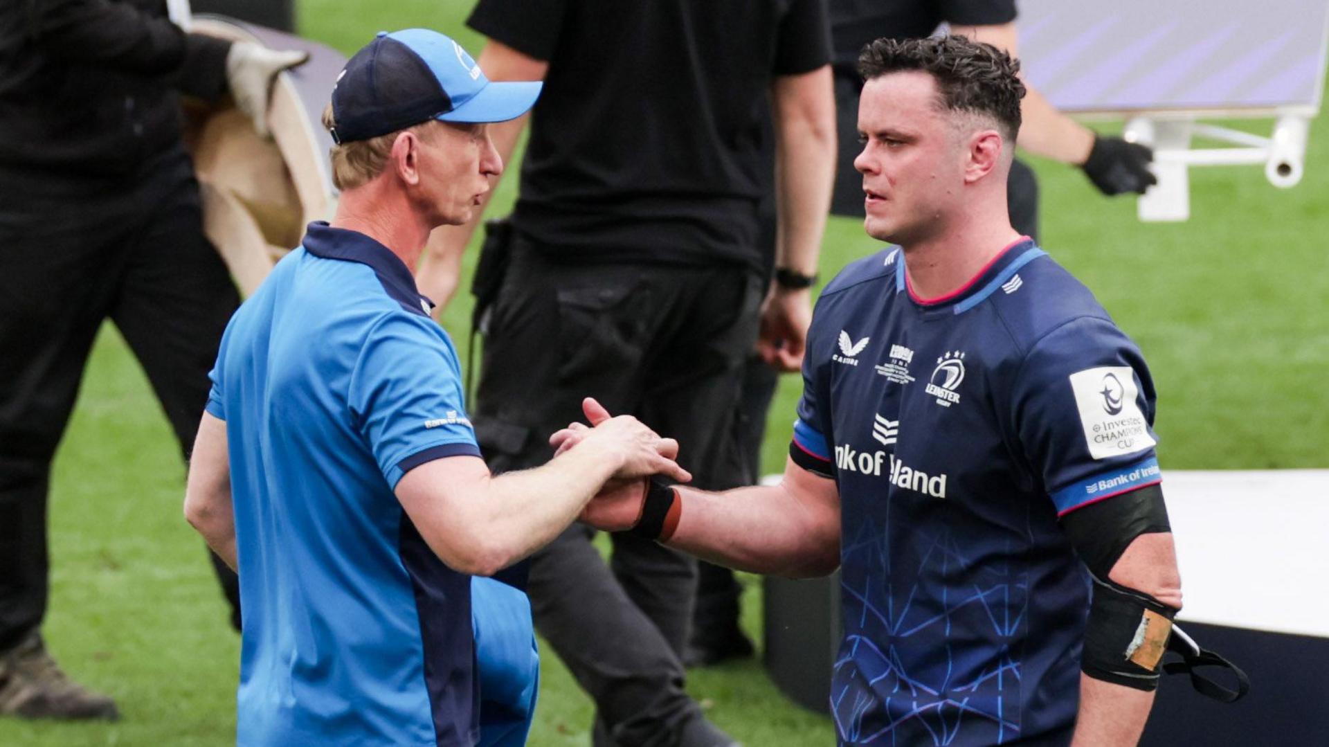 A dejected James Ryan shakes hands with Leo Cullen