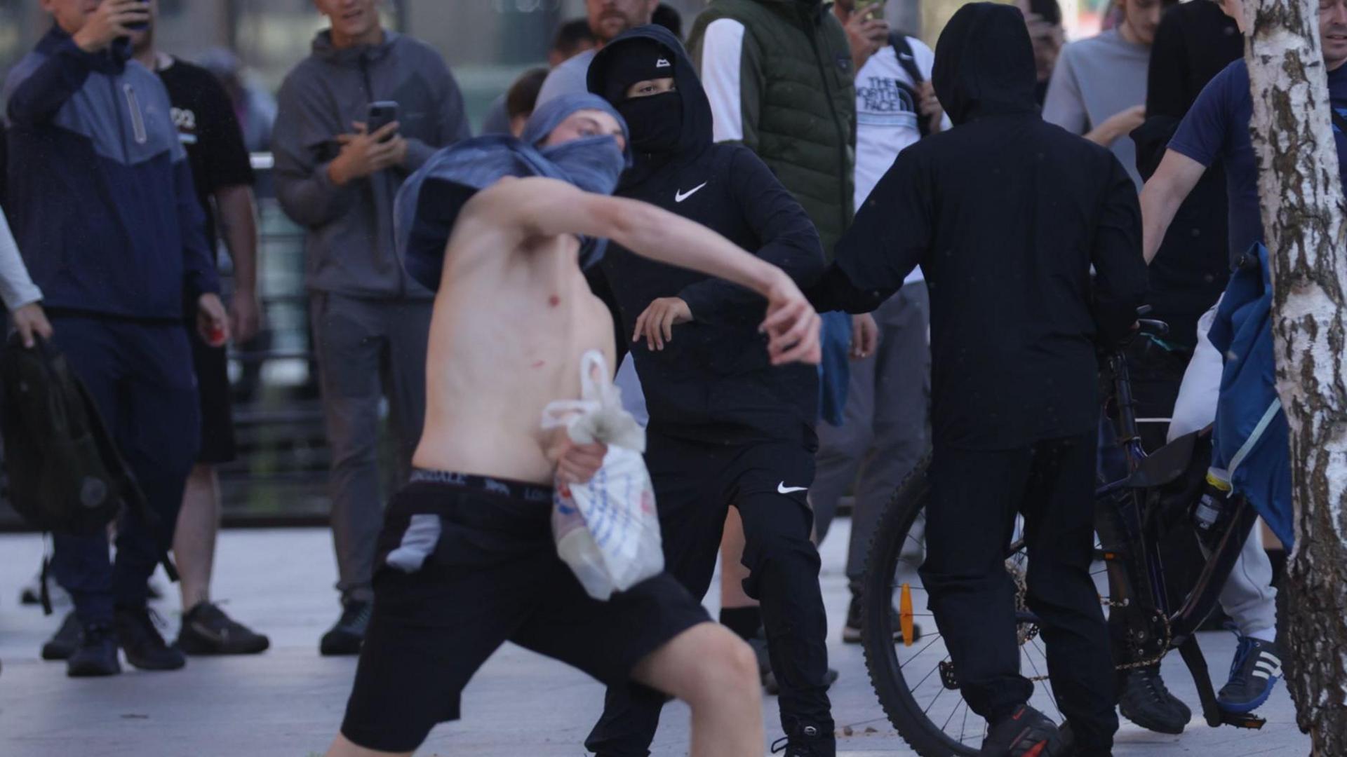 Violence broke out in Liverpool on Saturday afternoon after rival protesters converged