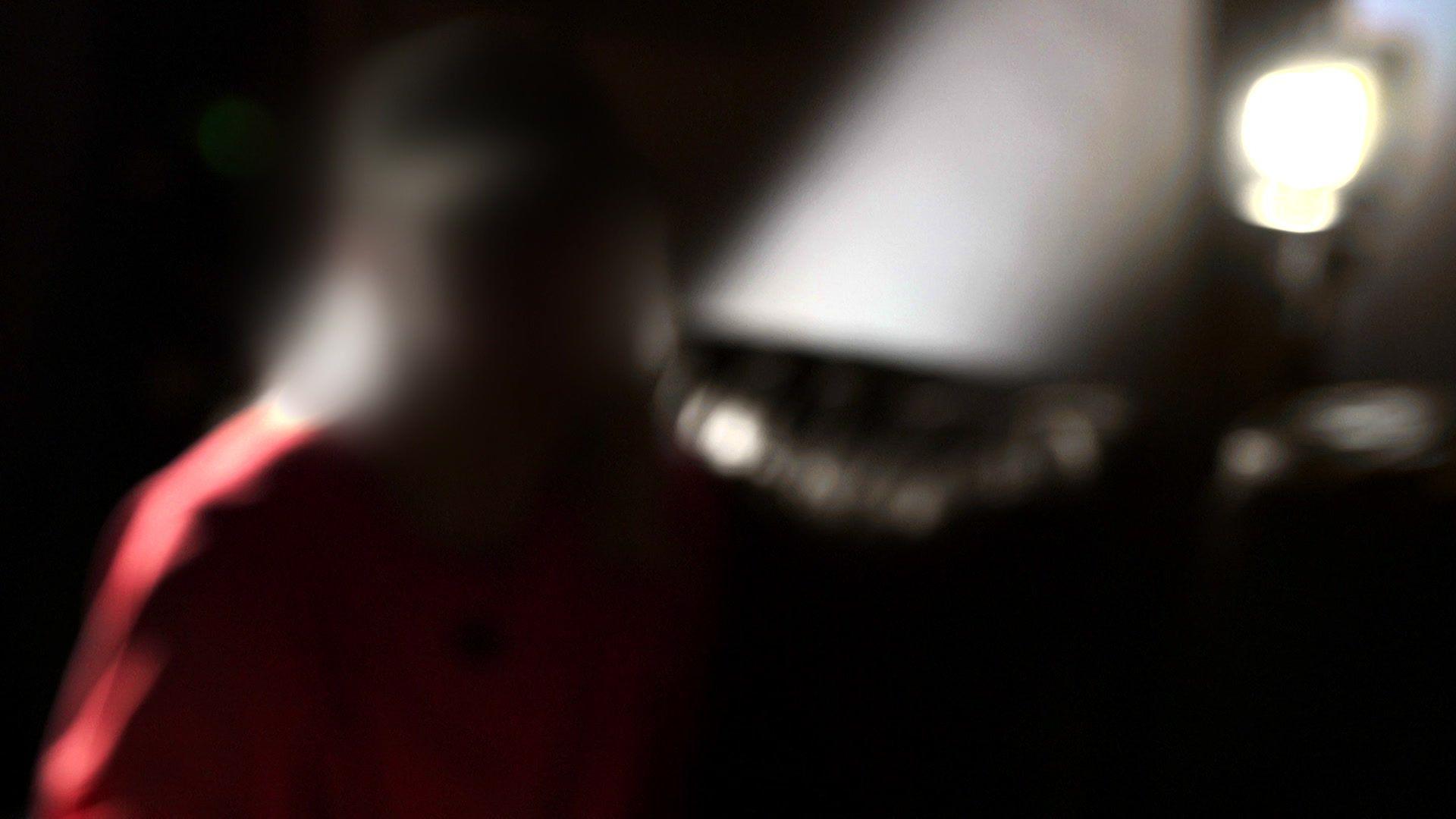 'Violet' is pictured in silhouette, sitting down, with a bright light behind her