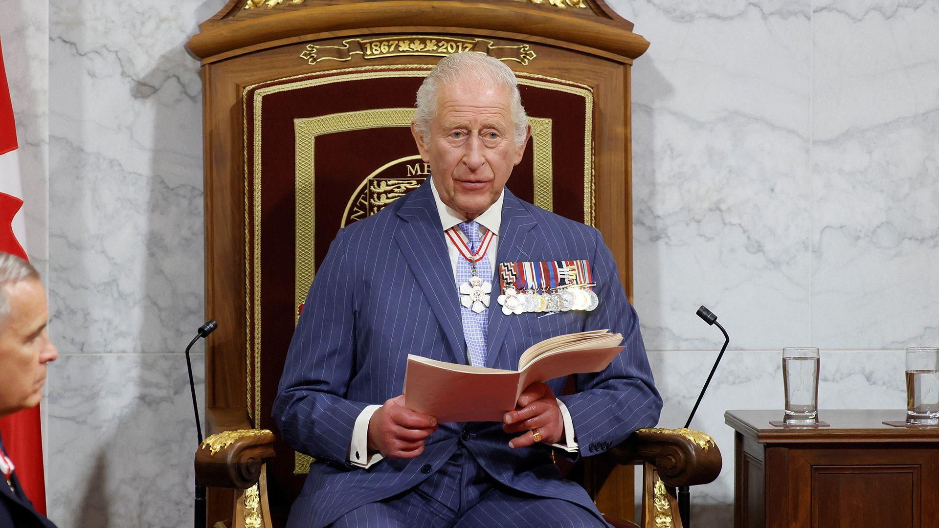 King Charles delivers a speech from the throne next to Canada's Prime Minister Mark Carney at the Senate Chamber in Ottawa, Ontario, Canada,