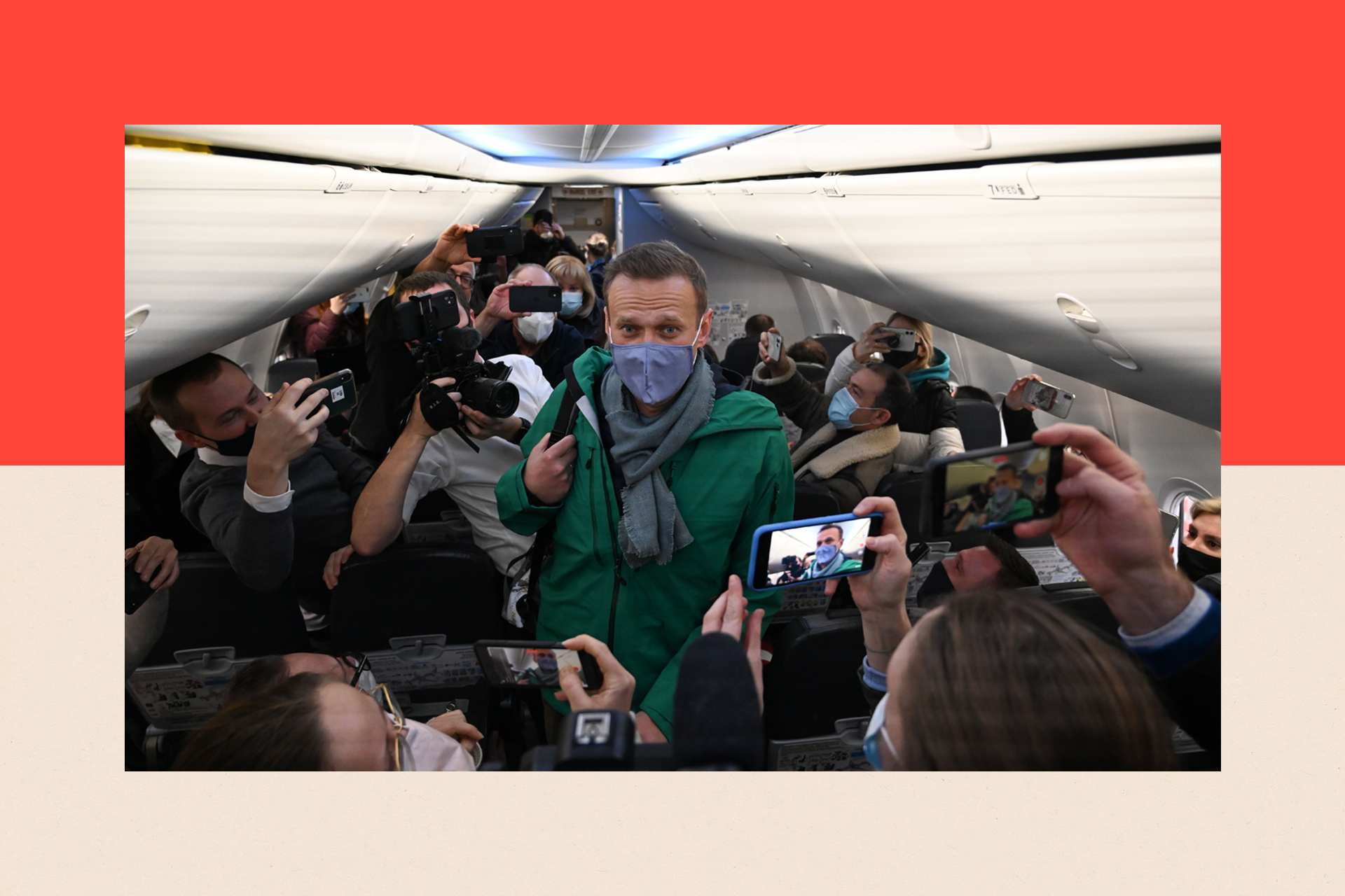 Russian opposition leader Alexei Navalny walks to take his seat in a Pobeda airlines plane heading to Moscow